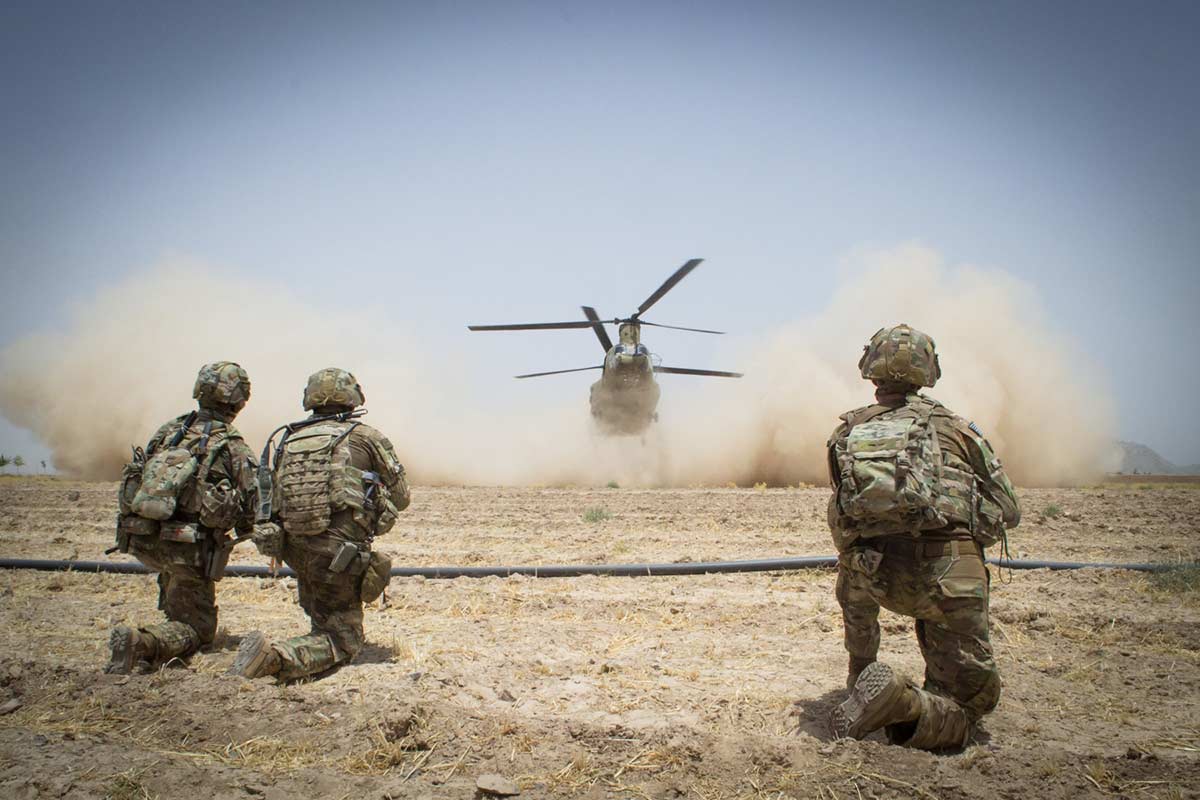 Paratroopers secure a helicopter landing zone for a CH-47 Chinook helicopter, July 20, 2019, in Kandahar Province, Afghanistan. (Maj. Thomas Cieslak/Army)