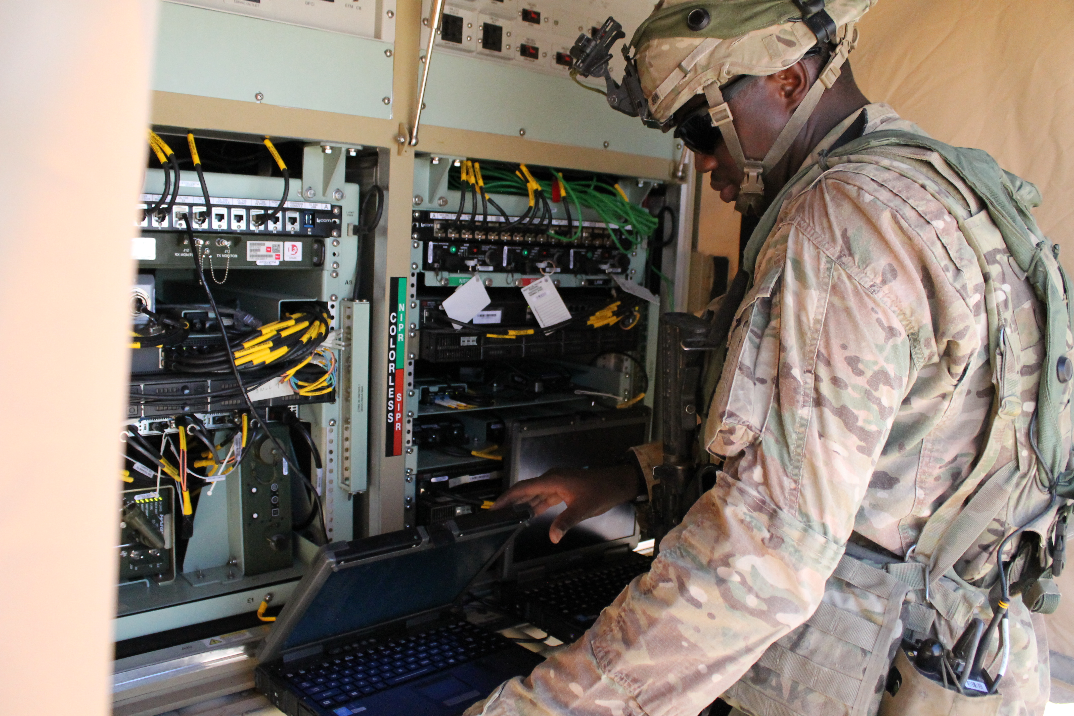 The TCN-L, now in a Humvee, can provide network connectivity on the move, and now consists of one flat panel at waist-level for easy access to the servers. Most of the equipment is now virtualized so it saves space and the air-conditioning to keep the system cool doesn’t have to push as hard so overheating isn’t as much of an issue, even in the desert in July. (Jen Judson/Staff)