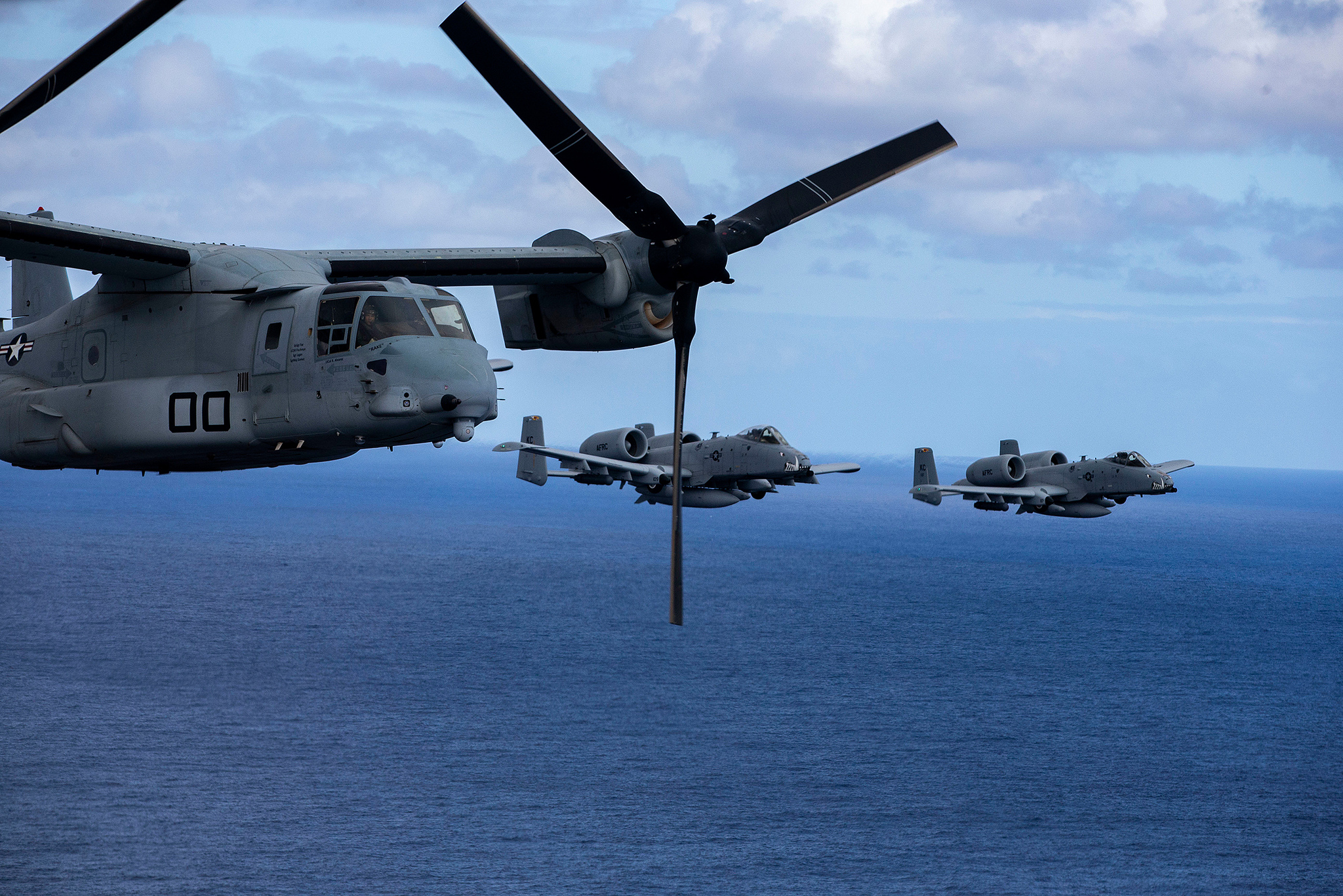 Air Force A-10 Thunderbolt II aircraft escort an MV-22B Osprey in Hawaii on Feb. 26, 2019. (Sgt. Alex Kouns/Marine Corps)