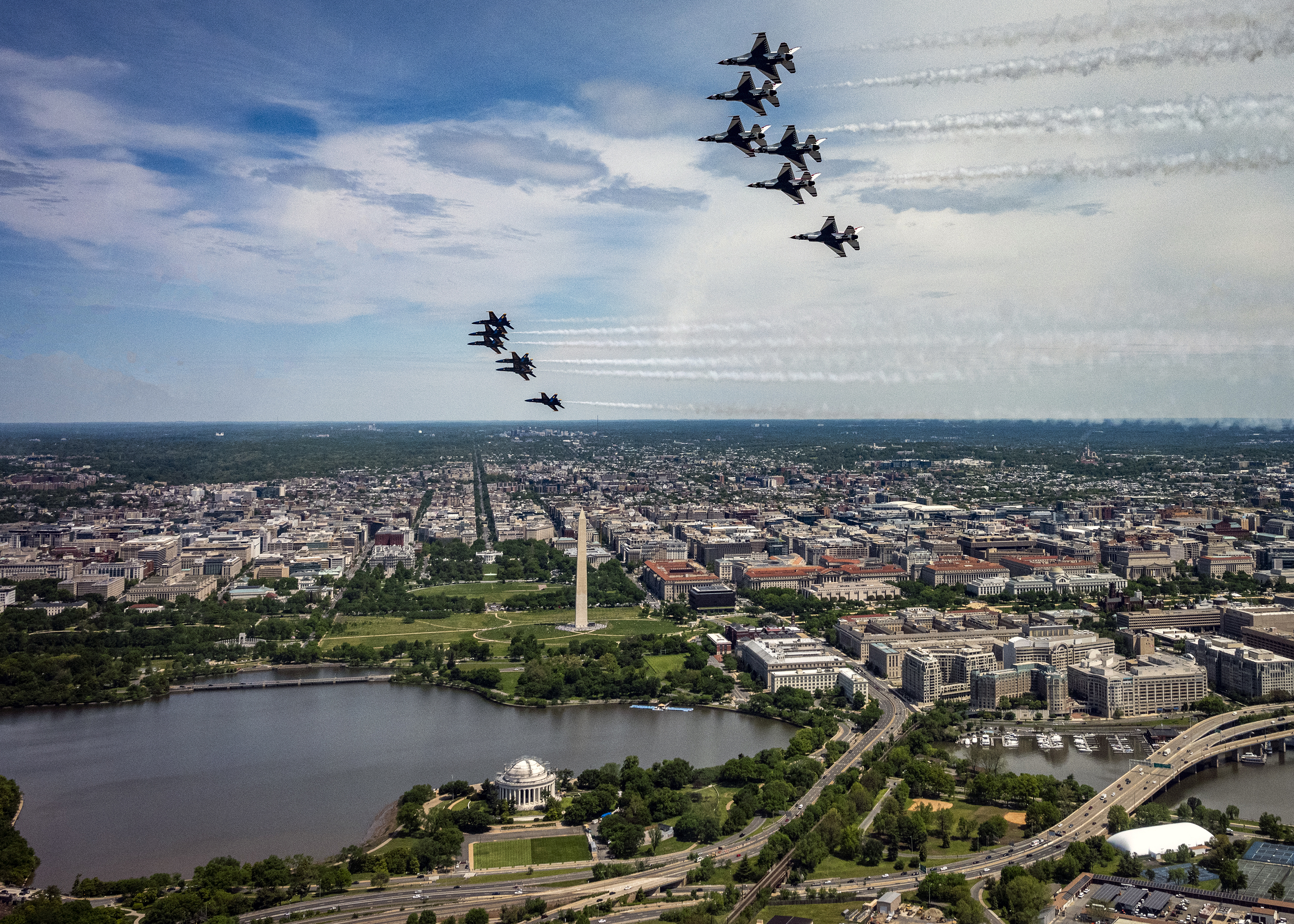 The U.S. Air Force Air Demonstration Squadron, the “Thunderbirds,” fly over Washington on May 2, 2020. The flyover was part of America Strong, a collaborative salute from the Air Force and Navy to recognize health care workers, first responders, military, and other essential personnel while standing in solidarity with all Americans during the COVID-19 pandemic. (Tech. Sgt. Ned T. Johnston/Air Force)