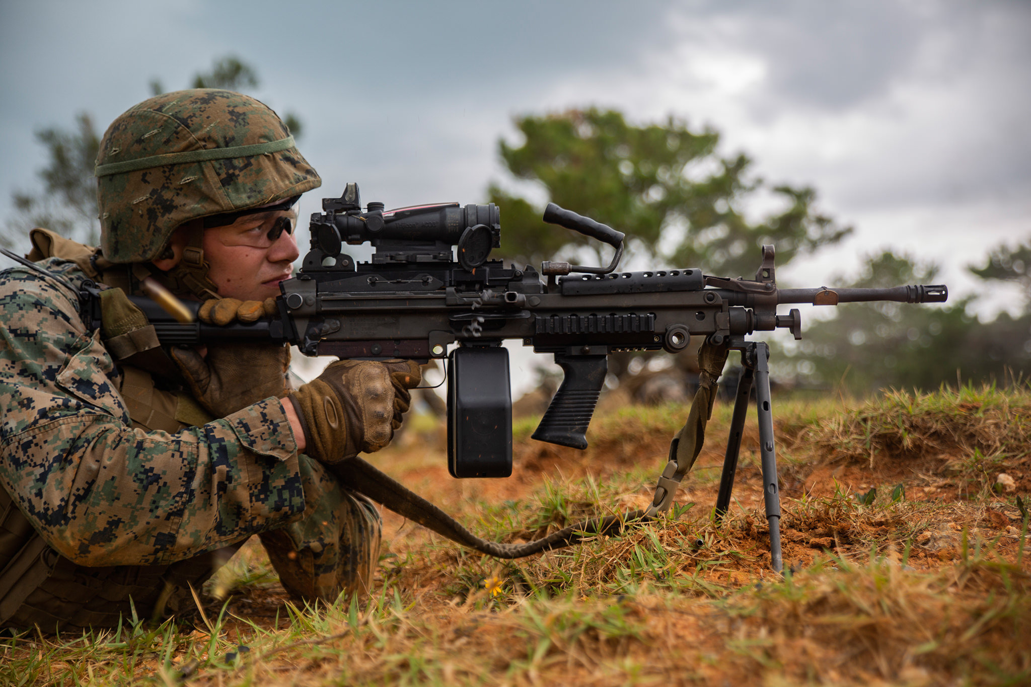 Cpl. Daniel Divirgilio fires a M249 Light Machine Gun at a target Oct. 24, 2018, during a fire and movement range at Camp Hansen, Okinawa, Japan. (Lance Cpl. Terry Wong/Marine Corps)