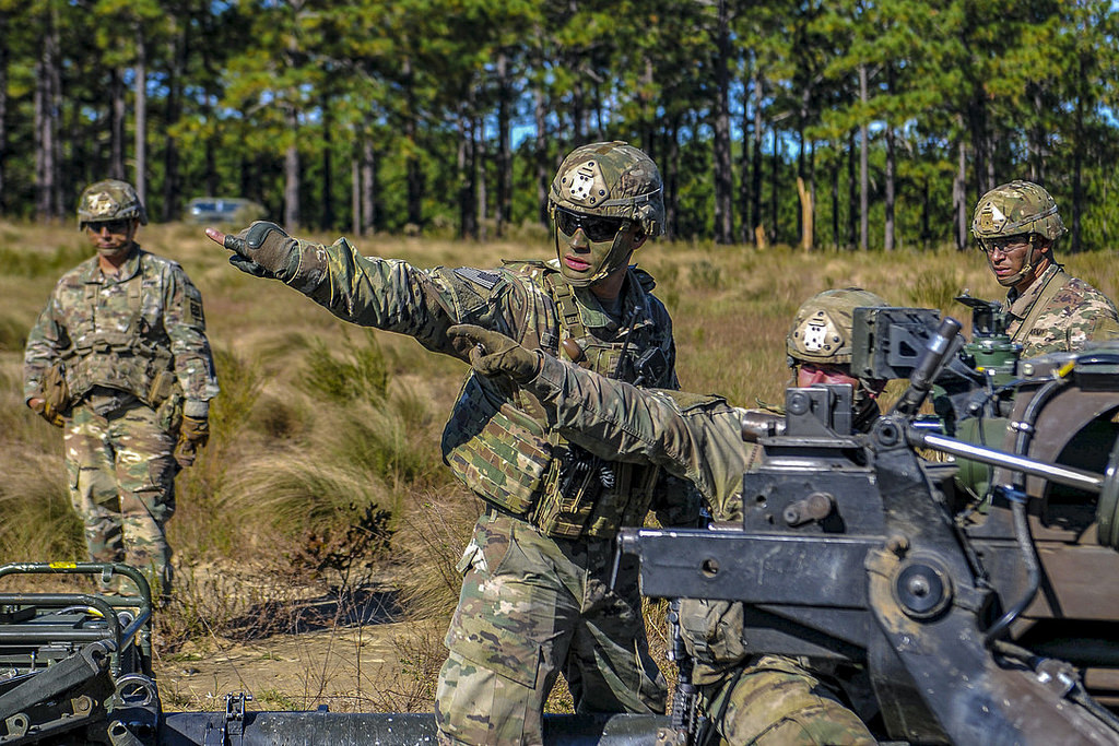 Paratroopers from Alpha Battery, 1st Battalion, 319th Airborne Field Artillery Regiment, 3rd Brigade Combat Team, 82nd Airborne Division sight in an M1193A Howitzer during an air assault and live-fire exercise held Oct. 24, 2018, on Fort Bragg, N.C. (Army)