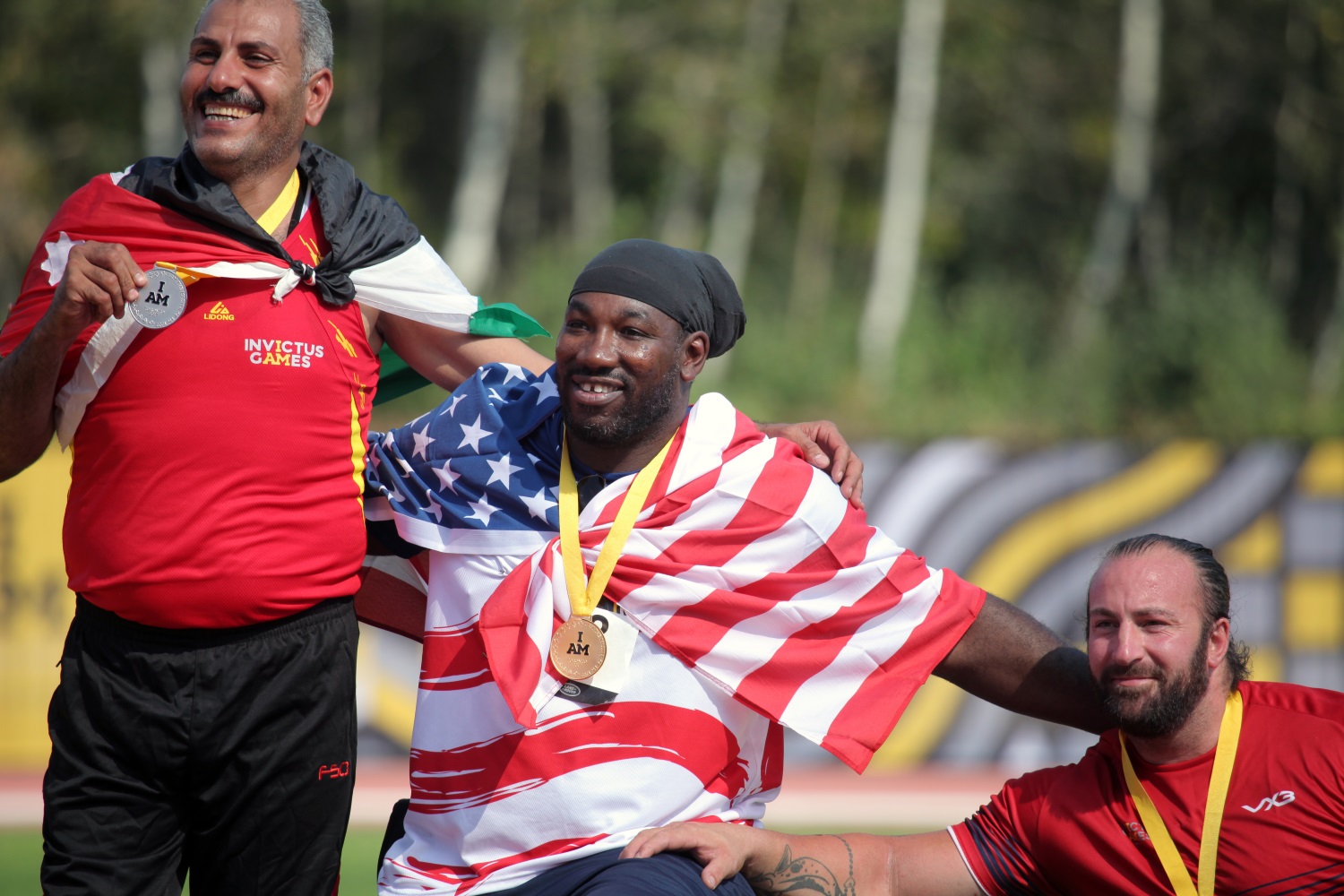 U.S. Army veteran Spc. Anthony Edward Pone sits with his fellow medalists at the Invictus Games. (Staff Sgt. Daniel Luksan/Army)