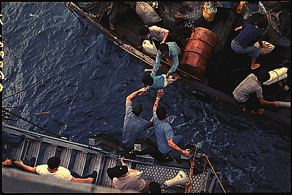 During the chaotic final days before the fall of Saigon, President Ford ordered the evacuation of Vietnamese orphans — a controversial plan that would be known as Operation Babylift. The mission began April 3, 1975. The first flight’s plane malfunctioned, leading to a crash landing that killed 78 children and 50 adults. More than 170 survived. In all, more than 3,300 children were evacuated to the U.S. Here, crewmen of the amphibious cargo ship Durham take Vietnamese refugees from a small craft in the South China Sea. (National Archives/Navy)