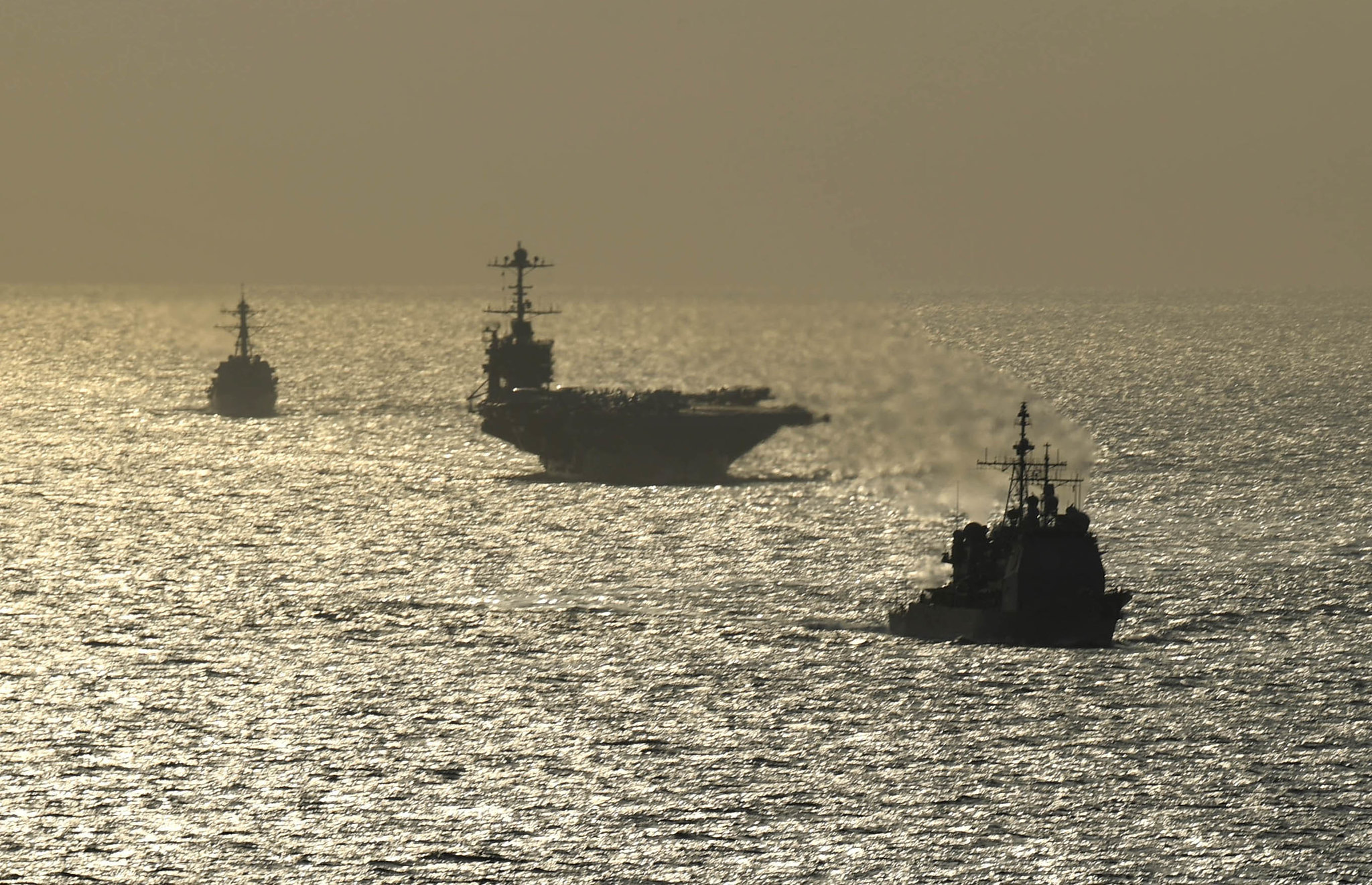 The Ticonderoga-class guided-missile cruiser USS Normandy (CG 60), front, the Nimitz-class aircraft carrier USS Harry S. Truman (CVN 75) and the Arleigh Burke-class guided-missile destroyer USS Lassen (DDG 82) transit the Atlantic Ocean on July 18, 2019. (Mass Communication Specialist 3rd Class Maxwell G. Higgins/Navy)