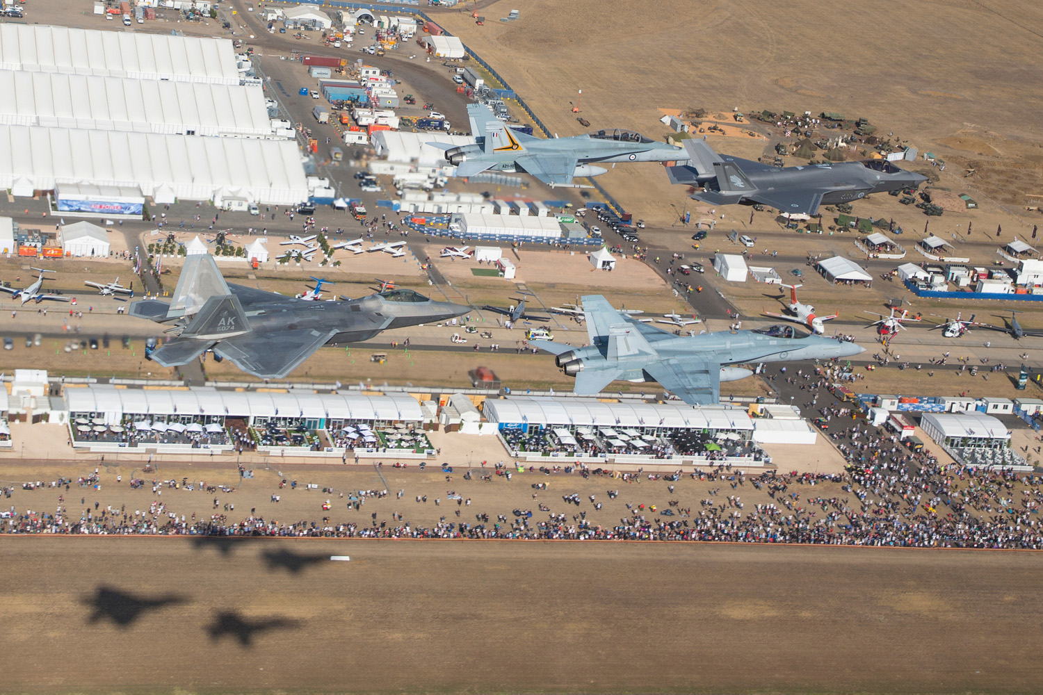 A special formation of a Royal Australian Air Force F-35A, two F/A-18A/B Hornets and a U.S. Air Force F-22A Raptor flies over the Avalon Airshow site during a joint display on March 1, 2019. (Commonwealth of Australia)