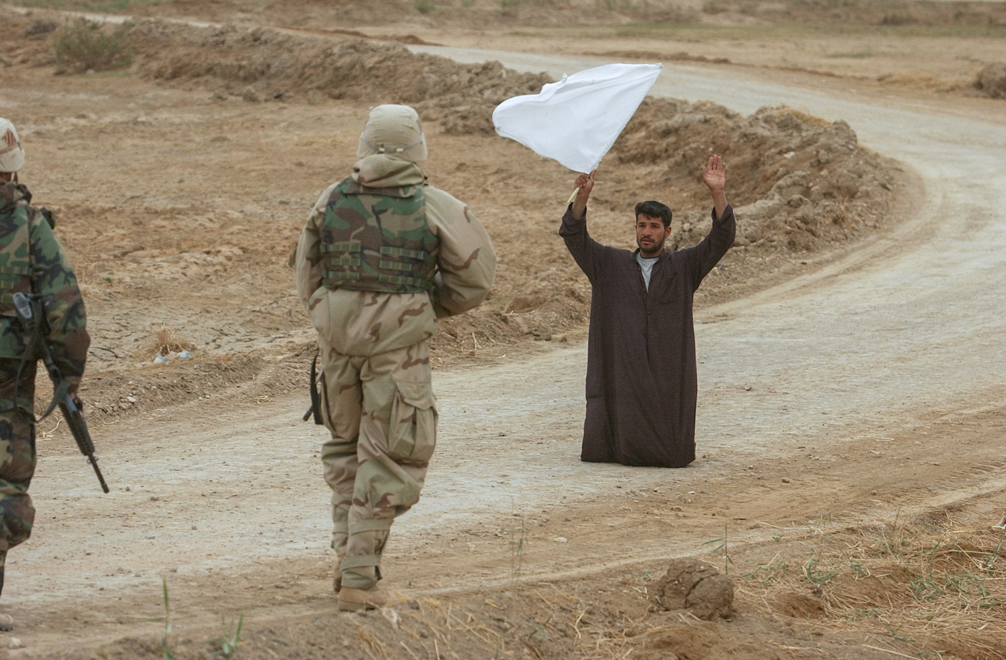 An Iraqi surrenders to Soldiers from 3rd ID. (Warren Zinn/Army Times)
