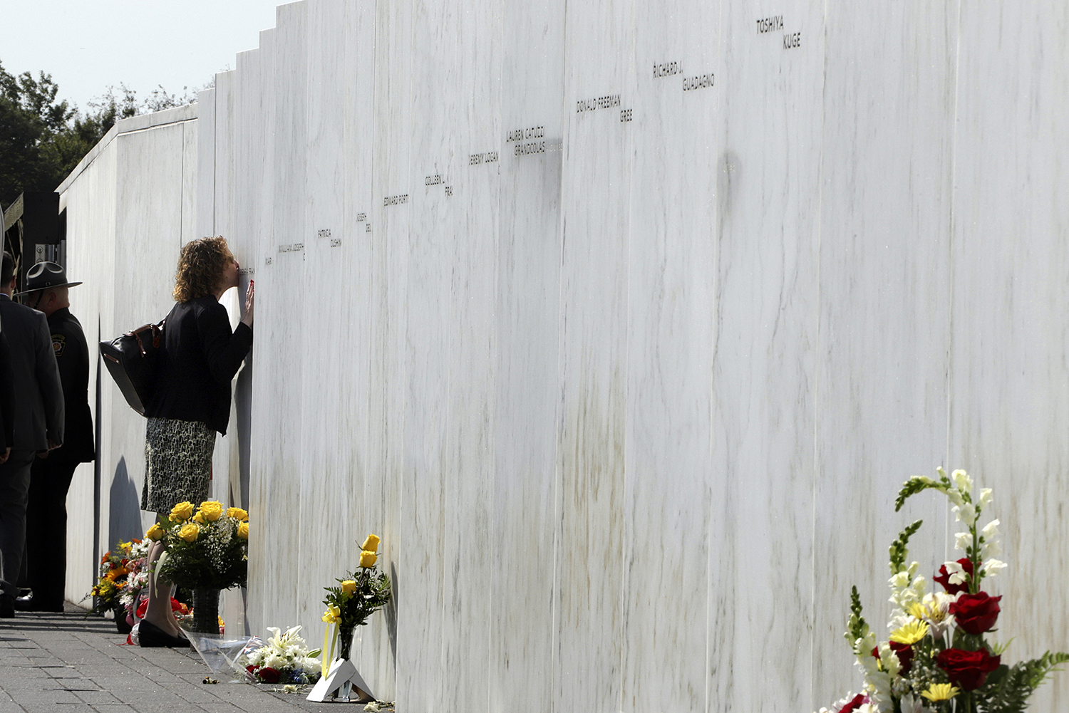 A woman pays respects at the Wall of Names at the Flight 93 National Memorial in Shanksville, Pa. after a Service of Remembrance Wednesday, Sept. 11, 2019, as the nation marks the 18th anniversary of the Sept. 11, 2001, attacks. The Wall of Names honor the 40 people killed in the crash of Flight 93. (Gene J. Puskar/AP)