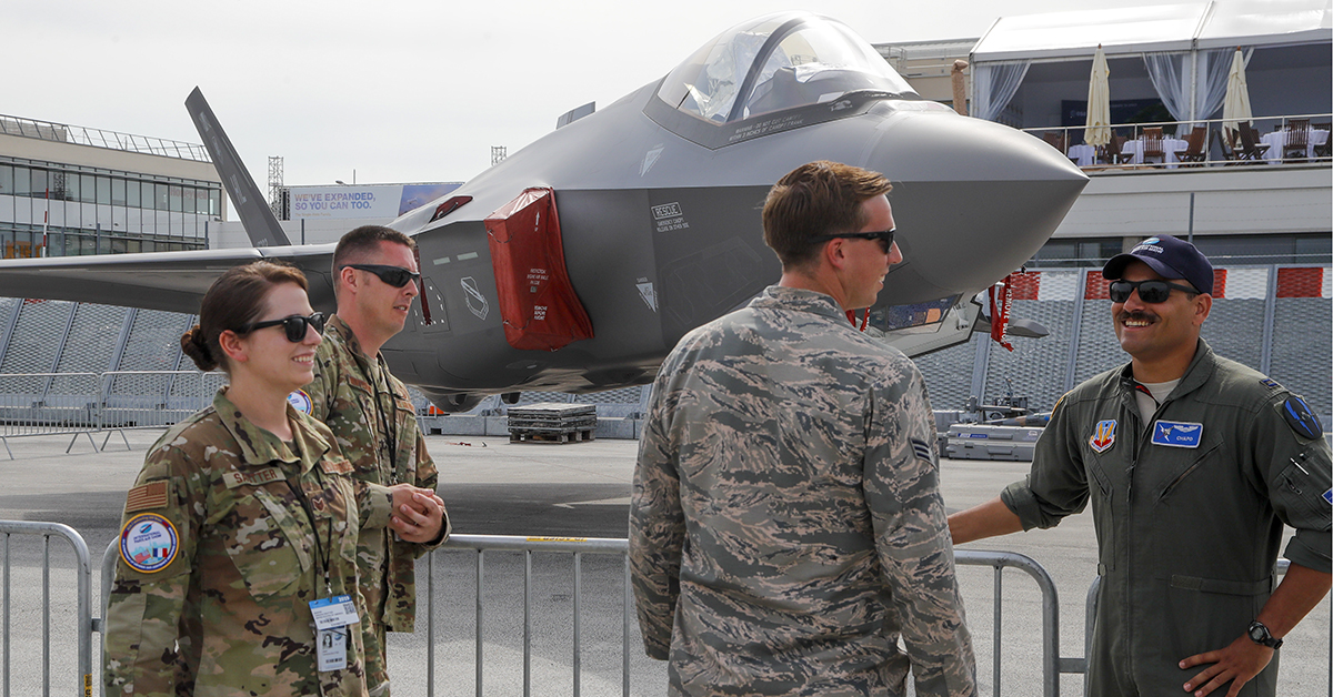 U.S Air Force crew members gather next to an F-35 Lightning II on display at the Paris Air Show. (Michel Euler/AP)
