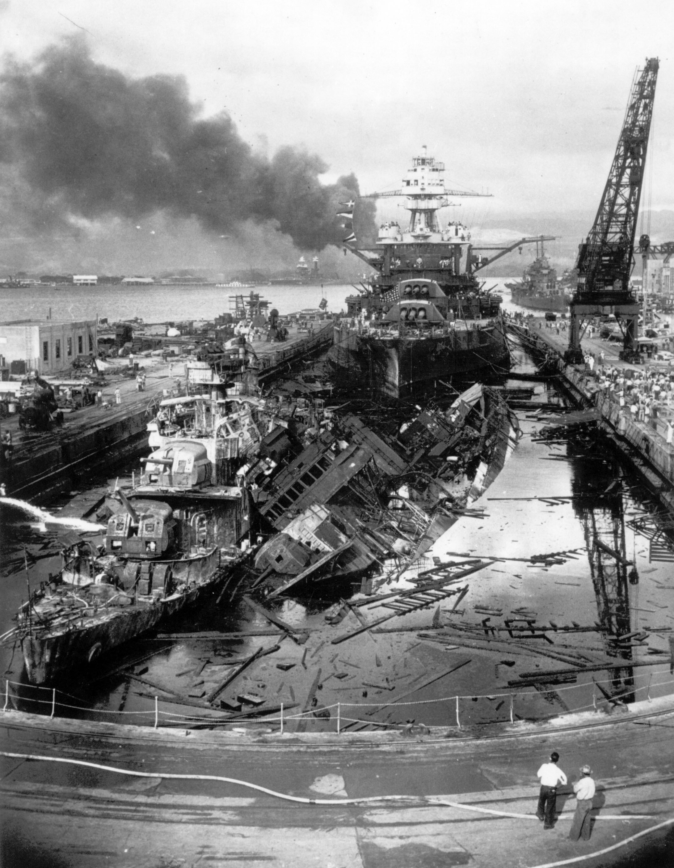 Black smoke rises from the burning wrecks of several U.S. Navy battleships after they had been bombed during the Japanese surprise attack on Pearl Harbor, Hawaii, on December 7, 1941. (AP Photo)