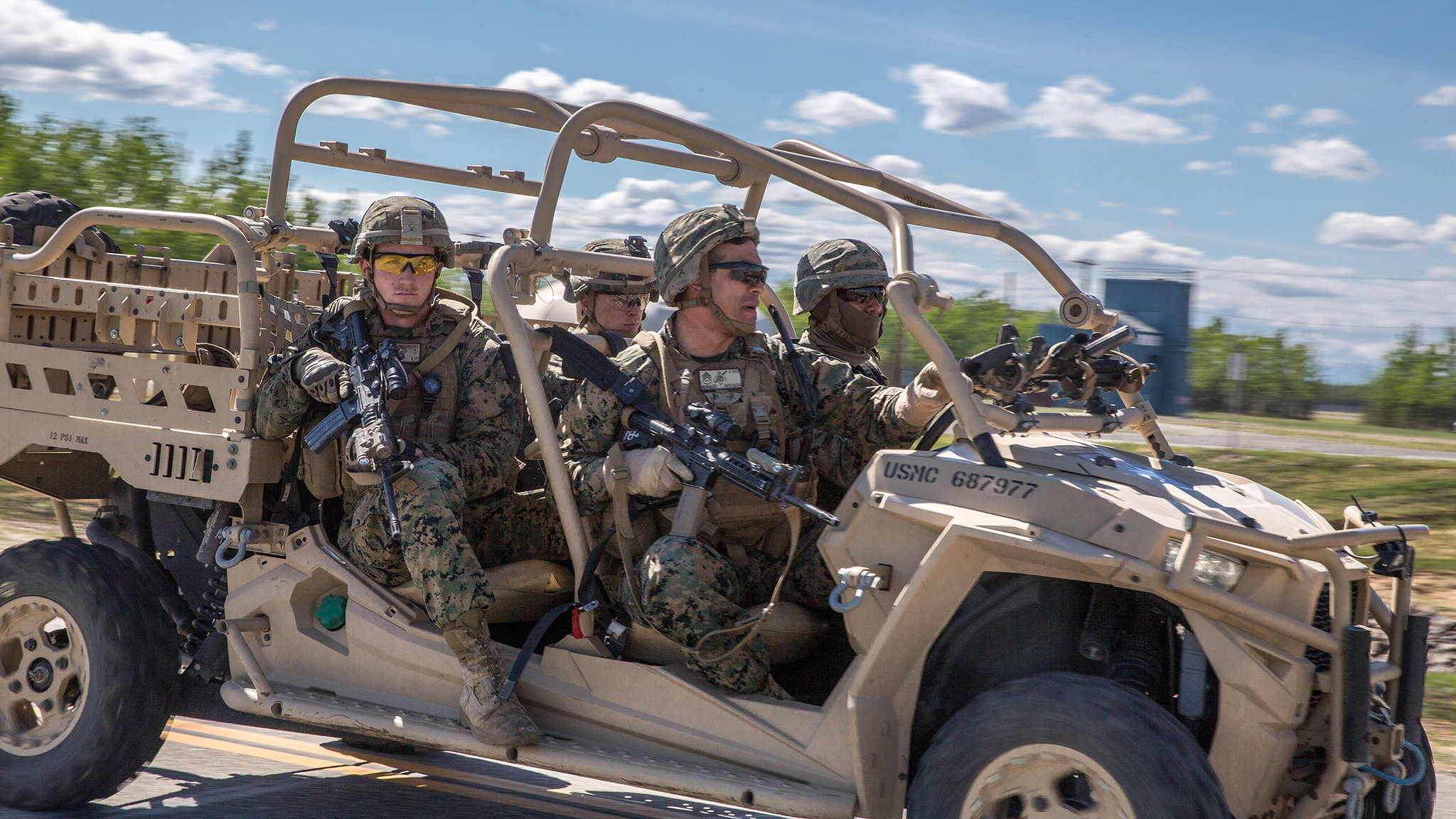 Staff Sgt. Juan Morales, front right, conducts a notional raid on a Polaris MRZR 4 vehicle on May 22, 2019, during exercise Northern Edge at Fort Greely, Alaska. (Cpl. Rhita Daniel/Marine Corps)