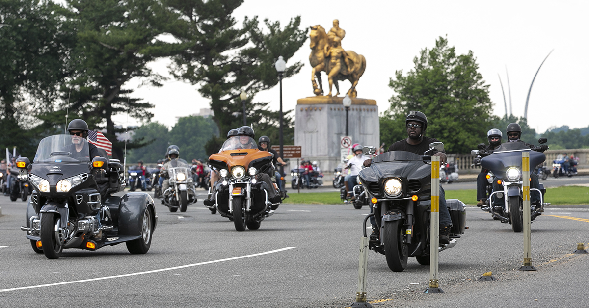 Riders circle around the back of the Lincoln Memorial with the Air Force Memorial in the backgroundduring Rolling Thunder XXXI First Amendment Demonstration Run in Washington, DC on Sunday May 27, 2018. Motorcycle riders from across the nation, rode a designated route through the Mall area of Washington, D.C. The event is an actual demonstration/protest to bring awareness and accountability for POWs and MIAs left behind.(Alan Lessig/Staff)