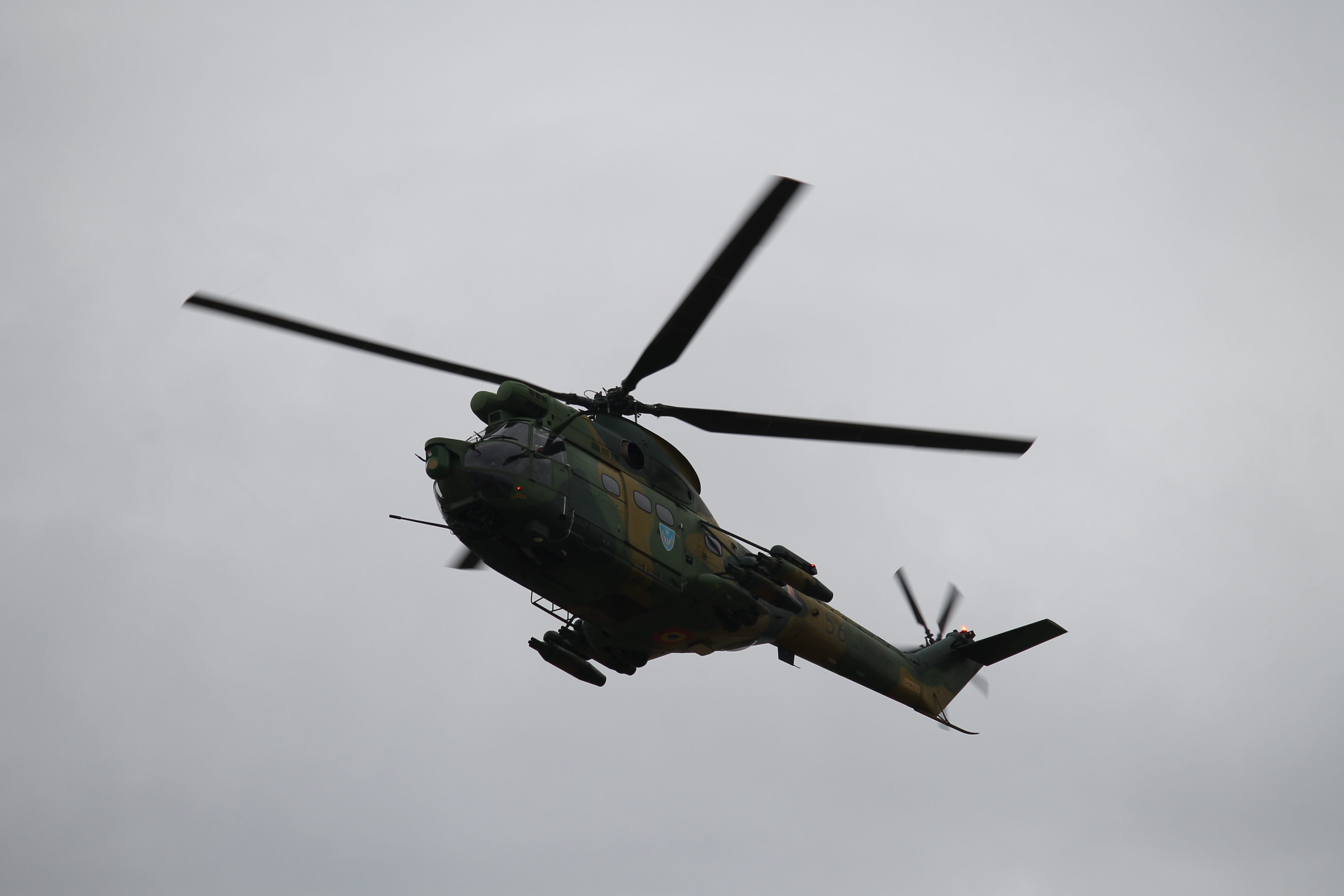 A Romanian-manufactured Puma helicopter continues to provide support for ground troops preparing to cross the bridge. (Jen Judson/Staff)
