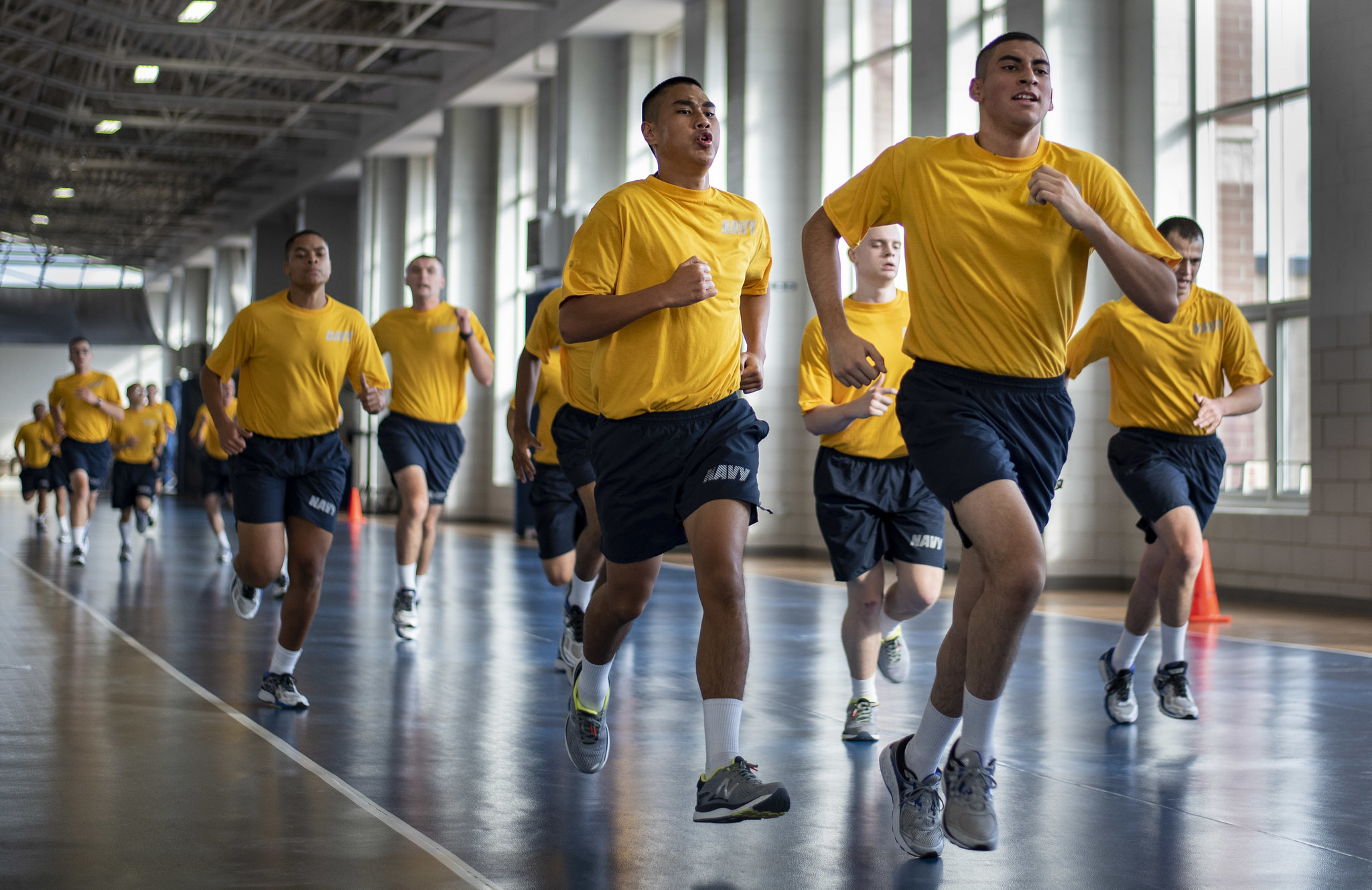 Recruits run sprints during a physical training session on Oct. 24, 2018, inside Freedom Hall at Recruit Training Command at Great Lakes, Ill. (MC2 Spencer Fling/Navy)