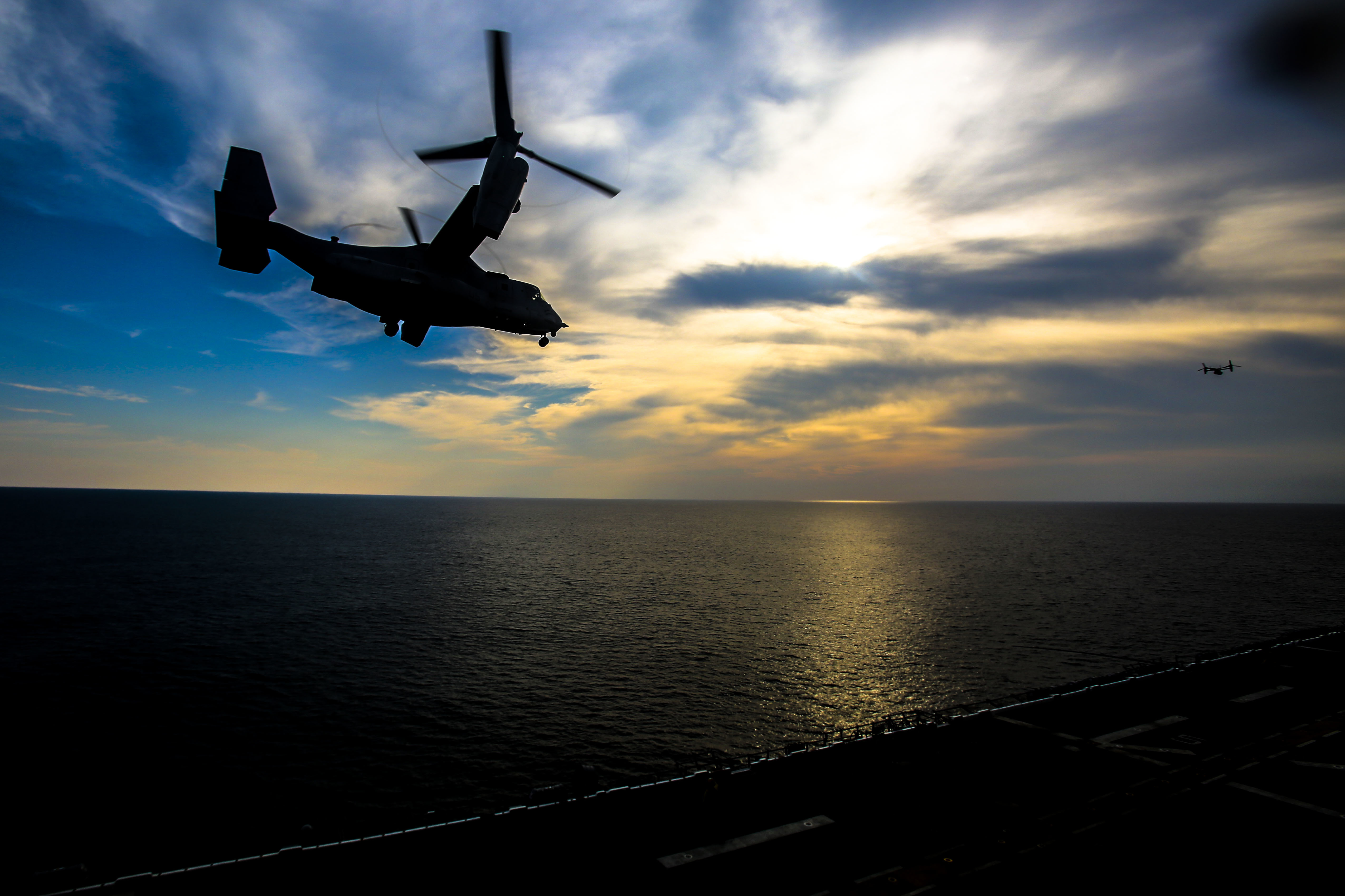 A U.S. Marine Corps MV-22B Osprey with Marine Medium Tiltrotor Squadron 162 (Reinforced), 26th Marine Expeditionary Unit (MEU), takes off from the amphibious assault ship USS Iwo Jima (LHD-7) as part of Combined Composite Training Unit Exercise (COMPTUEX) in the Atlantic Ocean. (Cpl. Jon Sosner/Marine Corps)