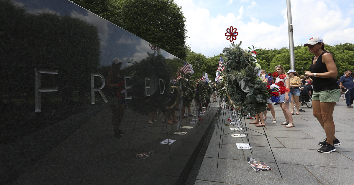 An onlooker looks at wreaths in the Korean War Memorial on Sunday, May 27 in Washington, D.C. during Memorial Day Weekend festivities throughout the city. (Ben Murray / Military Times)