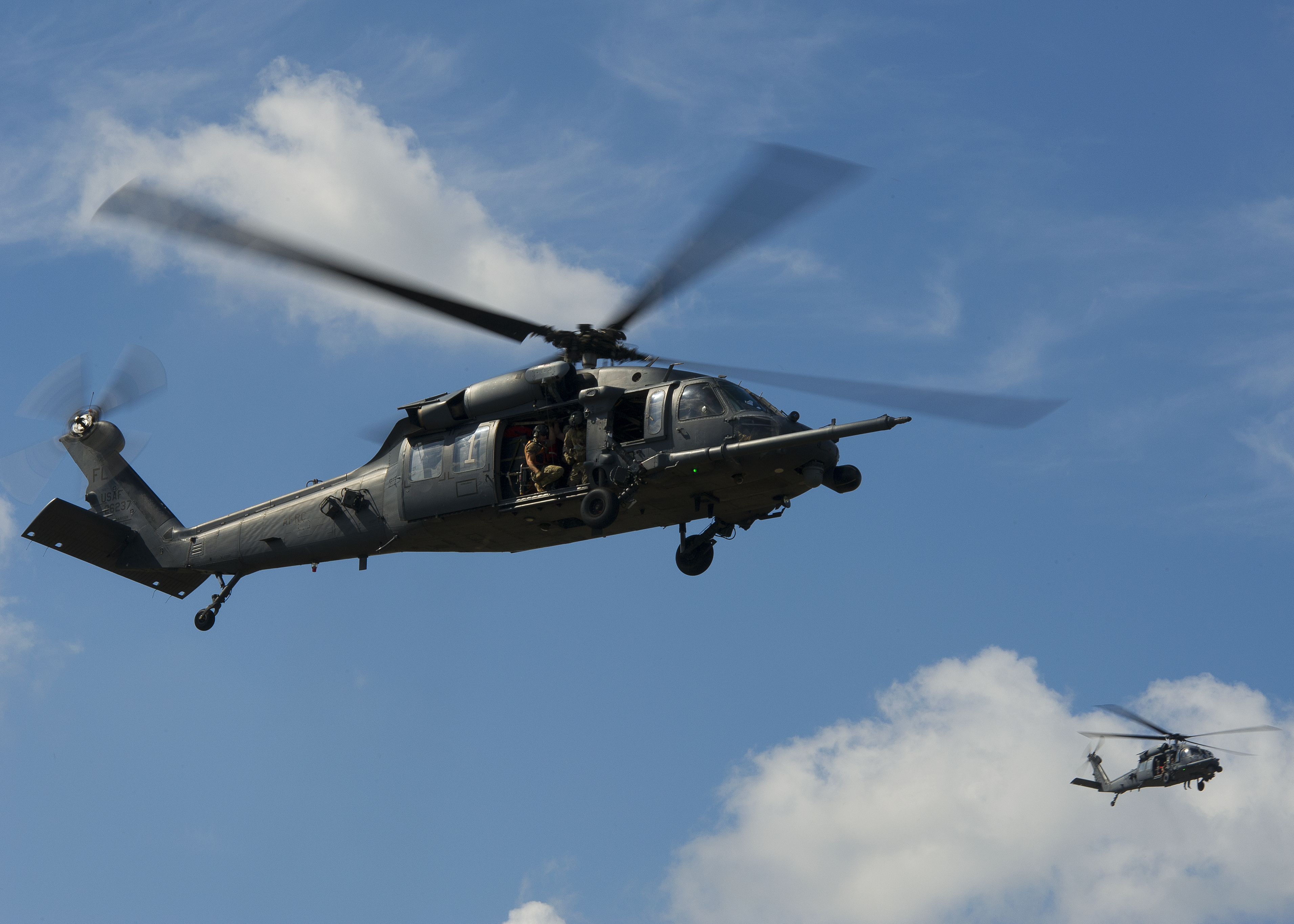Two U.S. Air Force HH-60 Pave Hawk helicopters from the 301st Rescue Squadron, Patrick Air Force Base, Florida, performs maneuvers during a training scenario supporting pararescuemen at Guardian Centers, Perry, Georgia, October 11, 2017. (Master Sgt. Stephen D. Schester/Air Force)