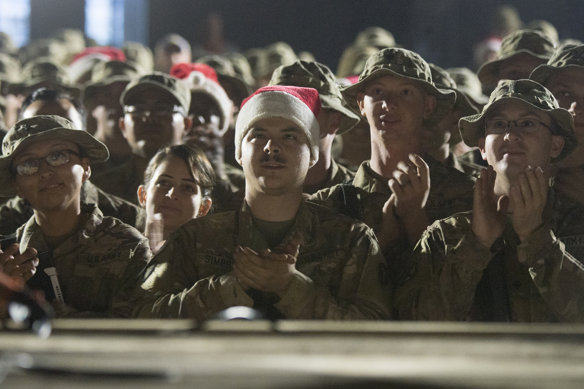 Soldiers from the 3rd and 4th Brigade 10th Mountain Division watch the USO Holiday Tour at Qayyarah West. (Navy Petty Officer 1st Class Dominique A. Pineiro/Dept. of Defense)