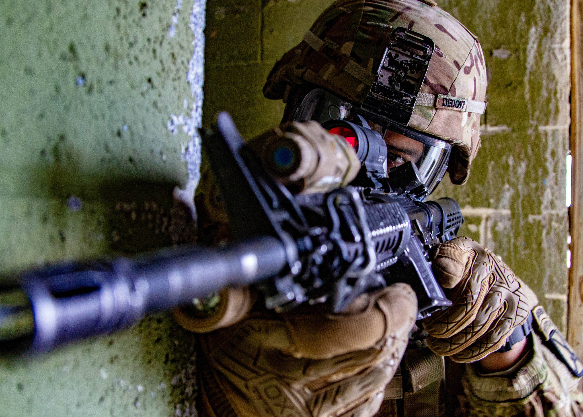 Capt. De Lao guards the corner of a hallway in a mock chemical environment during subterranean environment training at the platoon level at the Combined Arms Collective Training Facility at Fort Drum, N.Y., Nov 15, 2018. (Staff Sgt. James Avery/Army)