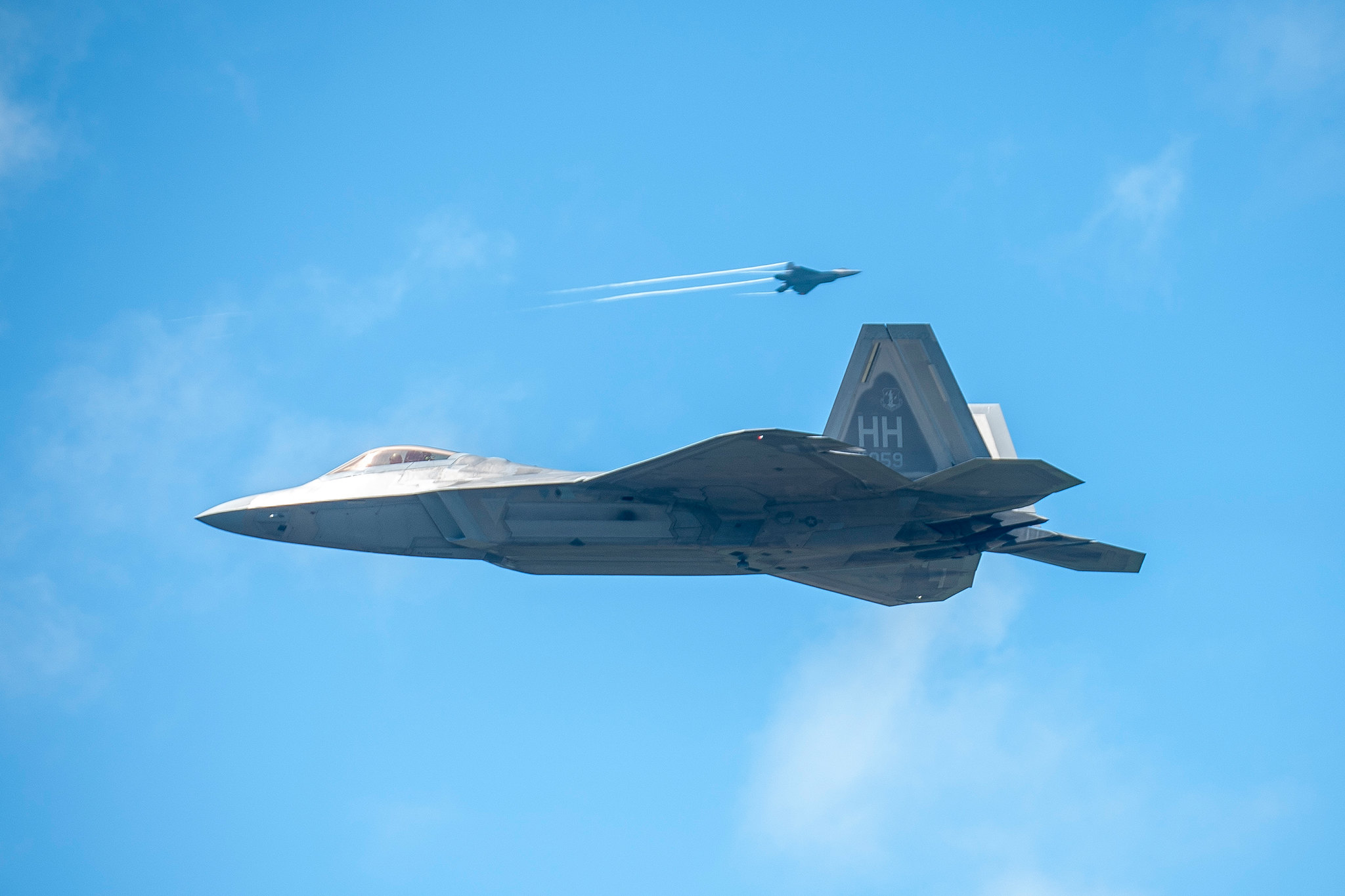 Hawaii Air National Guard F-22 Raptors from Joint Base Pearl Harbor-Hickam practice low approaches April 25, 2019, at the Palau International Airport, Republic of Palau. The fifth-generation-fighter aircraft landed in Palau for the first time as part of Resilient Typhoon, a Pacific Air Forces aircraft dispersal exercise. (Senior Airman John Linzmeier/Air National Guard)