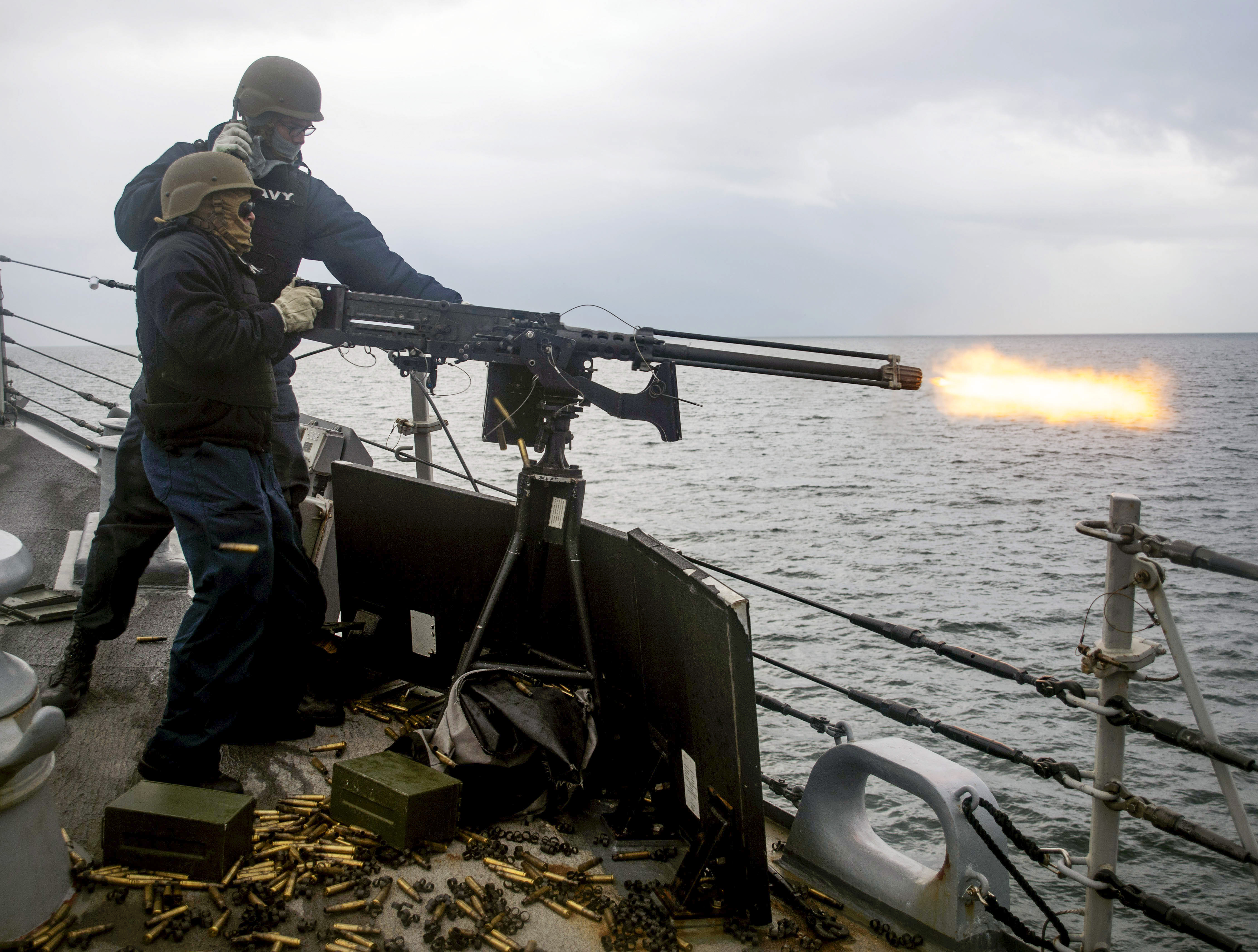 Sailors assigned to the guided-missile destroyer Ross fire a .50-caliber machine gun during exercise Joint Warrior 18-1 off the coast of Scotland. (MC1 Kyle Steckler/Navy)