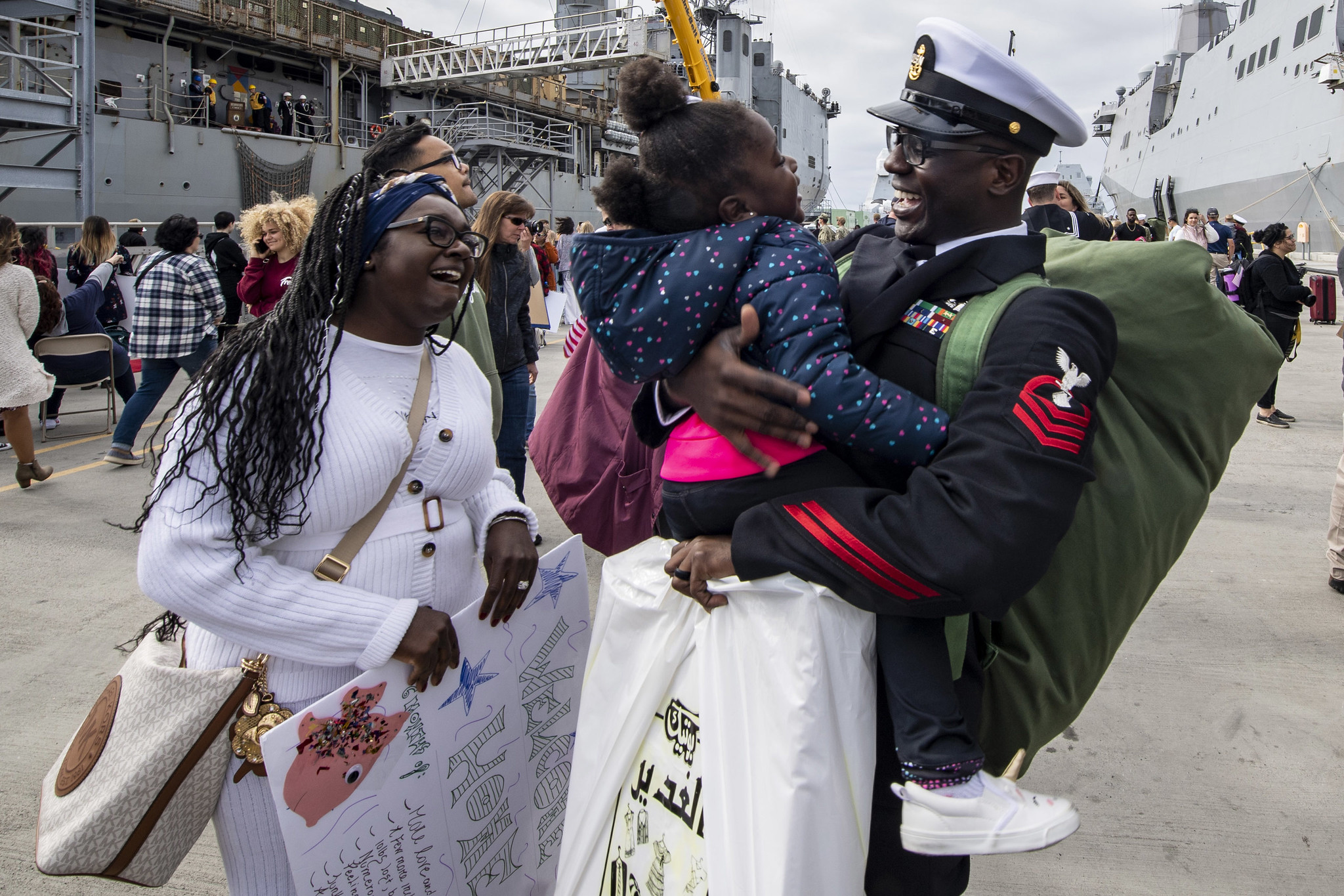 Chief Personnel Specialist Jonathan Kwakye, assigned to the amphibious transport dock ship USS John P. Murtha (LPD 26), reunites with his family Nov. 27, 2019, during a homecoming gathering at Naval Base San Diego. (Mass Communication Specialist 2nd Class Kyle Carlstrom/Navy)