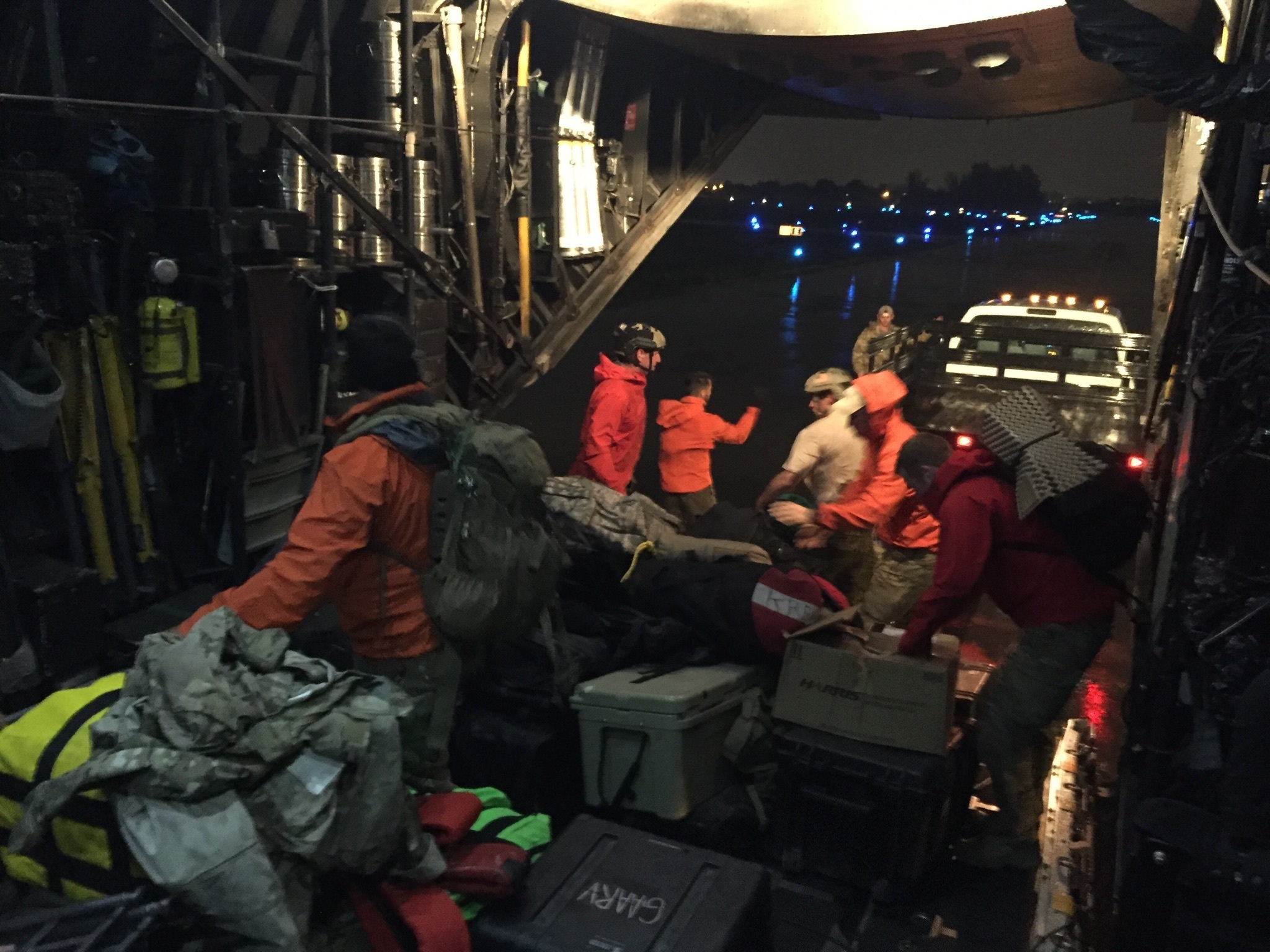 U.S. Air Force Guardian Angel pararescuemen from the 121st Rescue Squadron, Alaska Air National Guard, unload their equipment from an MC130P Combat Shadow aircraft assigned with the 129th Rescue Wing, California Air National Guard at Miami Opa Locka Executive Airport, Fla., as Hurricane Irma approaches Sept. 9, 2017. The Guardian Angel team are prepositioning themselves and staging equipment 20 miles outside of Miami in a safety bunker rated for a Category 5 hurricane in order to have immediate capability once the storm passes to begin personnel recovery operations. (Tech. Sgt. Joseph Prouse/Air National Guard)