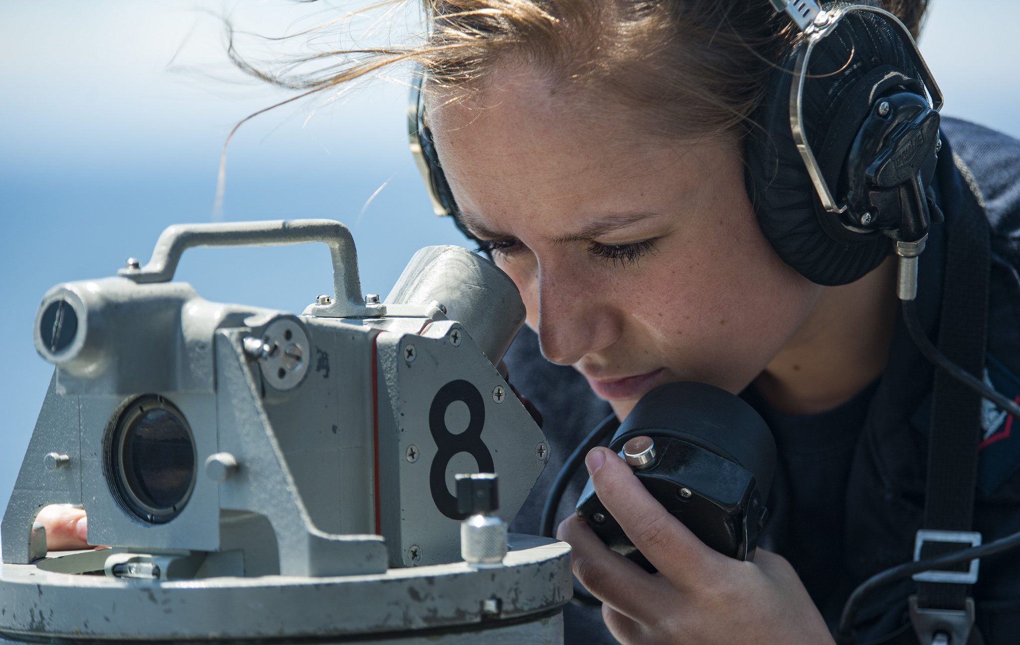 Quartermaster 3rd Class Meghin Warren reads bearings from a telescopic alidade aboard the amphibious assault ship USS Wasp (LHD 1). Wasp is transiting to Sasebo, Japan to conduct a turnover with the USS Bonhomme Richard (LHD 6) as the forward-deployed flagship of the amphibious forces in the U.S. 7th Fleet area of operations. (Mass Communication Specialist 3rd Class Levingston Lewis/Navy)