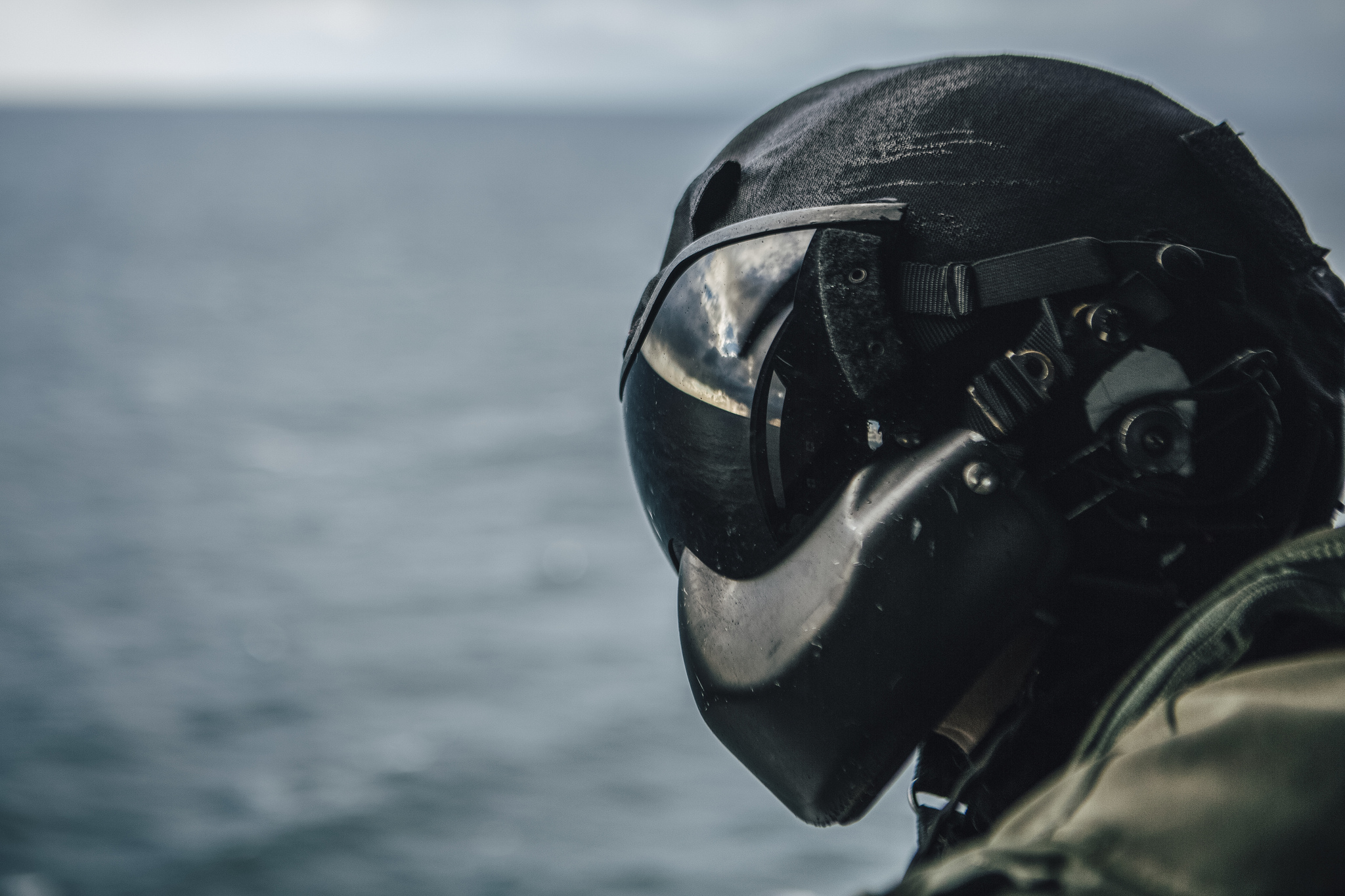 Marine Corps Sgt. Cade Allen, a UH-1Y Venom crew chief, scans the horizon during flight operations in the Pacific Ocean, Feb. 20, 2019. (Lance Cpl. Jason Monty/Marine Corps)