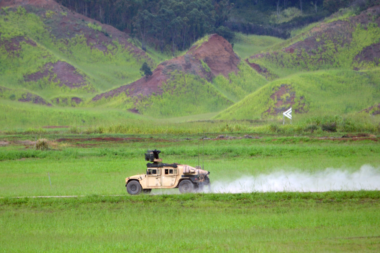 Soldiers assigned to the 3rd Brigade Combat Team, 25th Infantry Division, race their M115A1 HMWVV to the next target to engage it with an M153 Common Remotely Operated Weapon Station (CROWS) at the Battle Area Complex (BAX), Schofield Barracks, Hawaii, on Nov. 7, 2107. The soldiers participated in a crew gunnery to qualify with their weapon systems before depart for the Joint Readiness Training Center located at Fort Polk, La., next year. (Staff Sgt. Armando R. Limon/Army)
