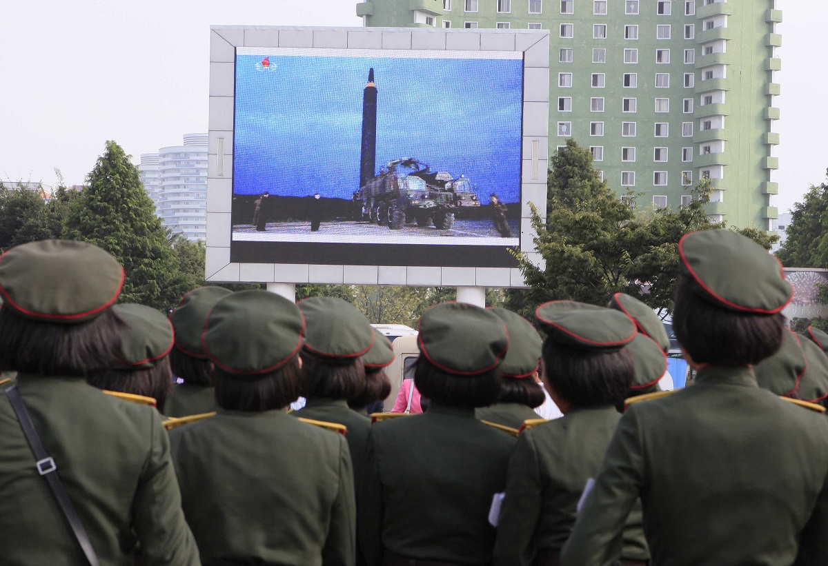 People fill the square of the main railway station to watch a televised news broadcast of the test-fire of the ICBM Hwasong-12 on Aug. 30, 2017, in Pyongyang, North Korea. Fired on Aug. 28, North Korea fired a Hwasong-12 over the northern Japanese island of Hokkaido. (Kim Kwang Hyon/AP)