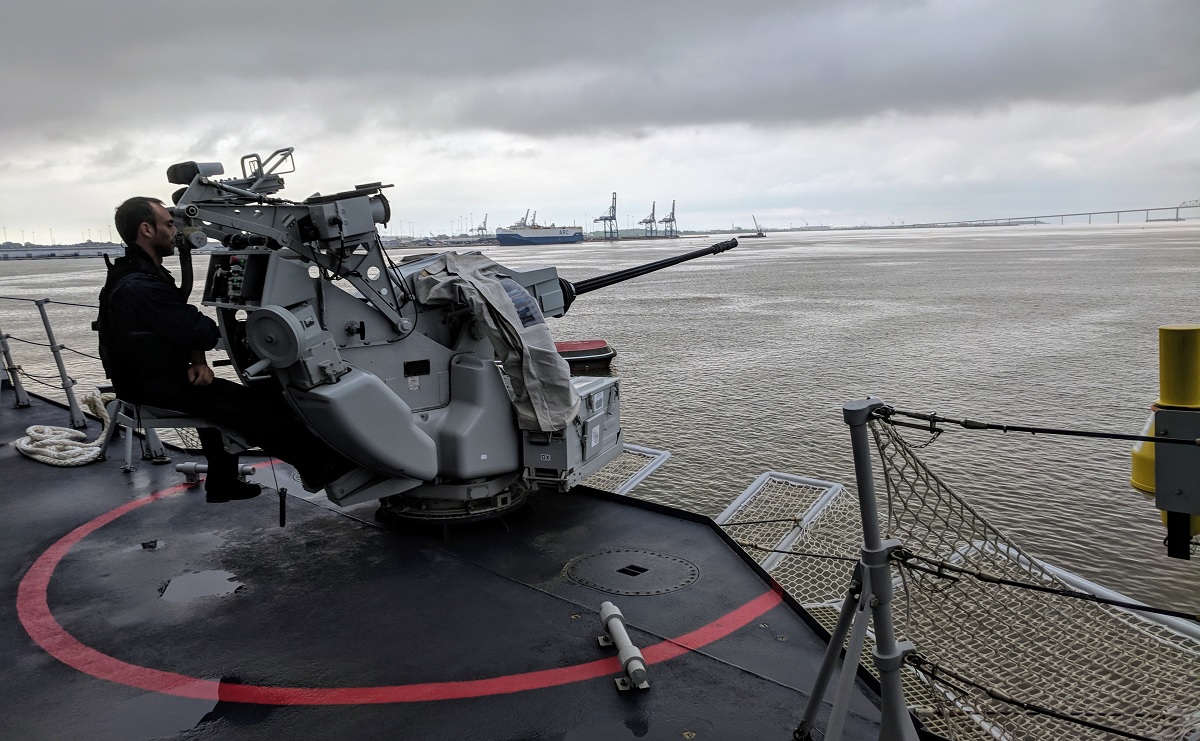 A sailor mans the Italian FREMM Alpino's 25mm gun mounted on the bridge wing. It is primarily used for force protection. (David B. Larter/Staff)