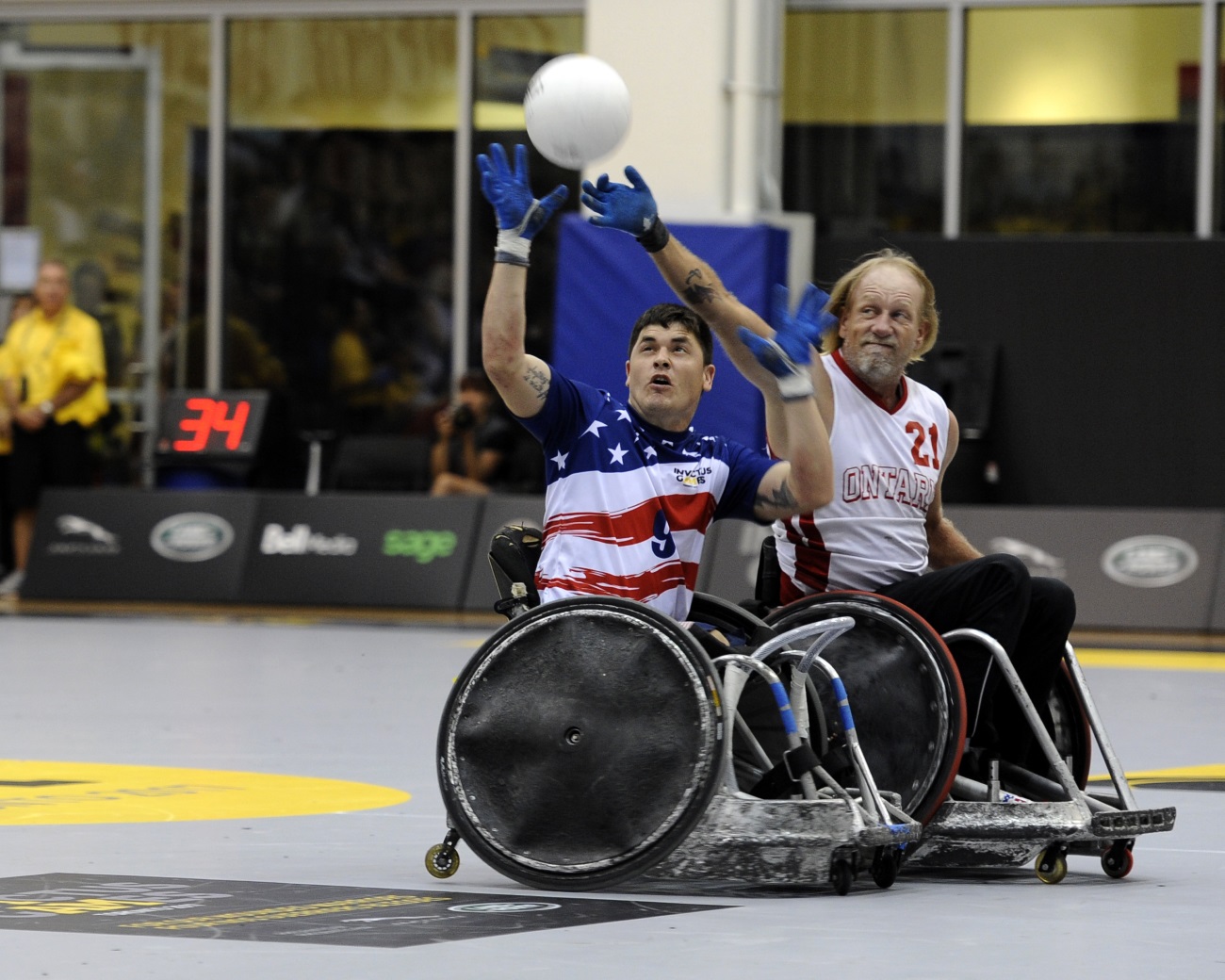 U.S. Marine Corps Sgt. Ivan Sears intercepts a pass during a wheelchair rugby match against the Italian team during the 2017 Invictus Games at the Mattamy Athlethics Centre in Toronto, Canada, on Sept. 27, 2017. The Invictus Games are the sole international adaptive sporting event for injured active-duty and veteran service members. (Staff Sgt. Jannelle McRae/Air Force)