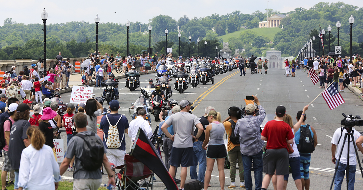 Riders in the Rolling Thunder Memorial Day motorcycle procession ride across the Memorial Bridge, with Arlington National Cemetery in the background as they enter Washington, D.C. on Sunday, May 27, as part of the annual remembrance festivities in the city. (Ben Murray / Military Times)