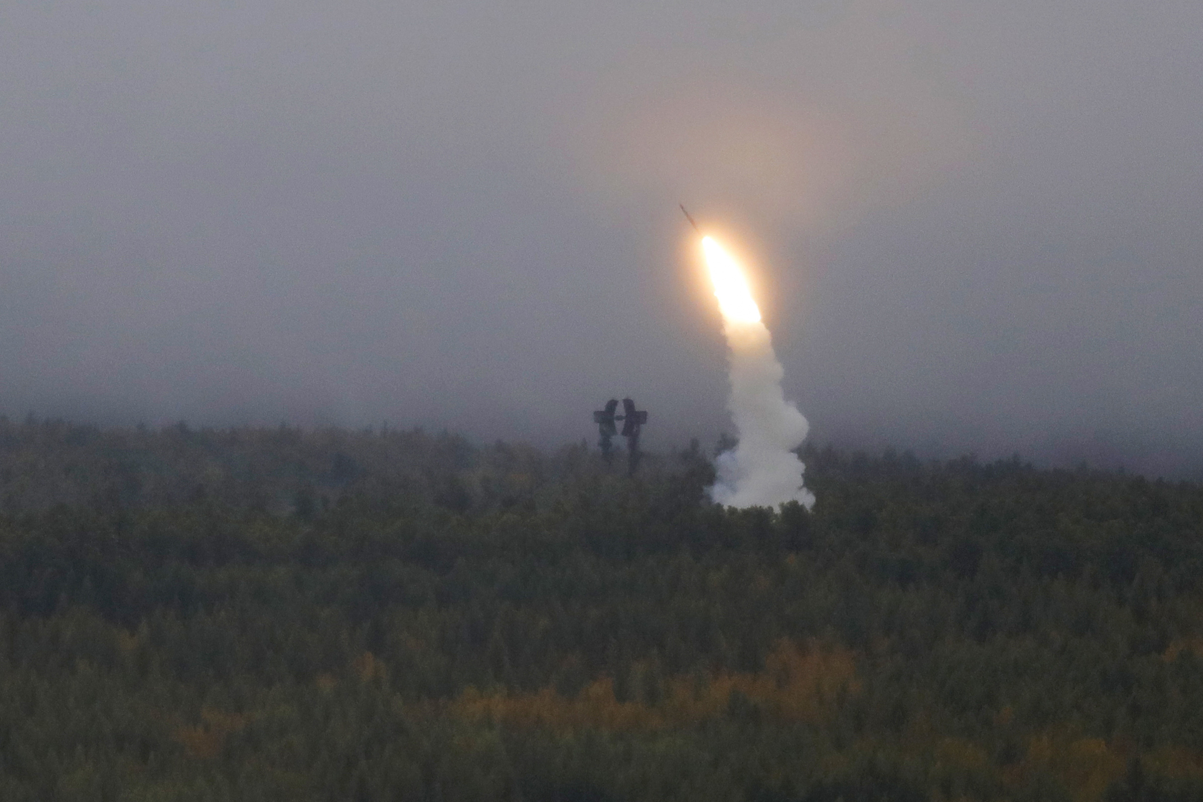 An air defense missile system flies during a military exercises on training ground 