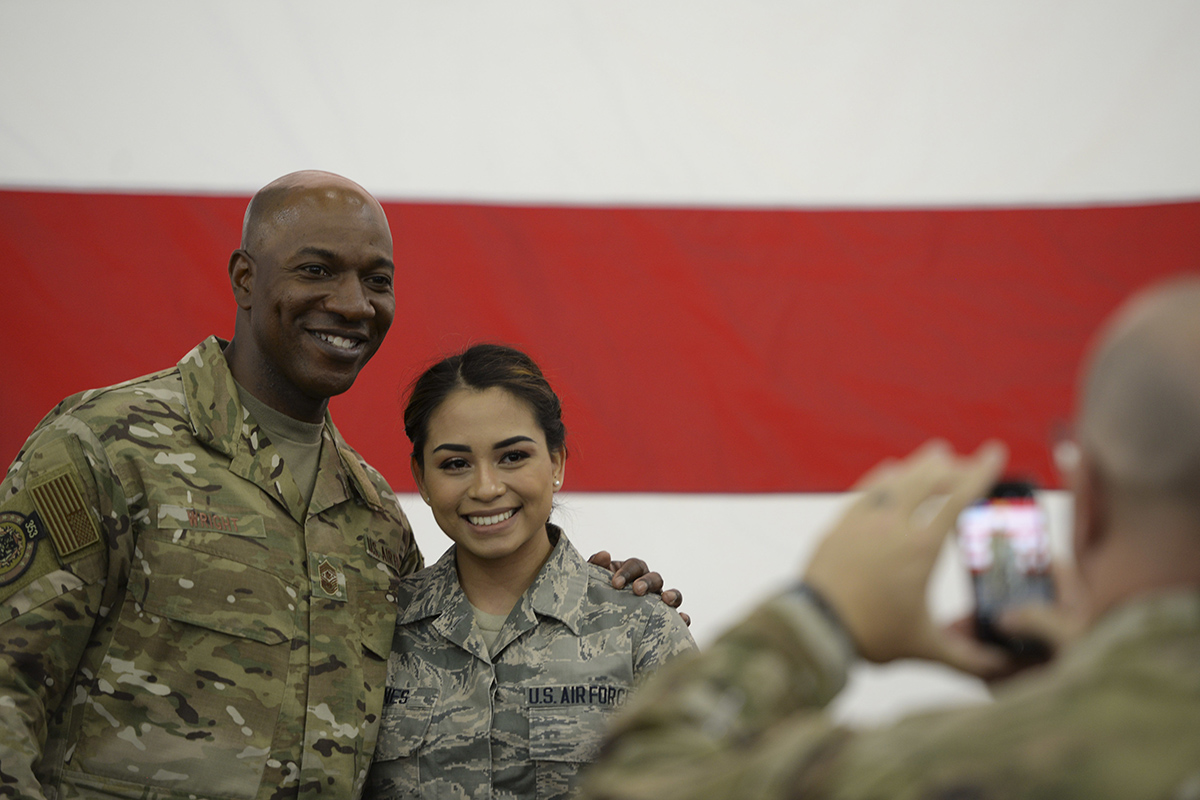 Chief Master Sgt. of the Air Force Kaleth O. Wright poses for a photo with an airman after an all call at Baker Field House on Eielson Air Force Base, Alaska, June 12, 2019. (Senior Airman Kahdija Slaughter/Air Force)