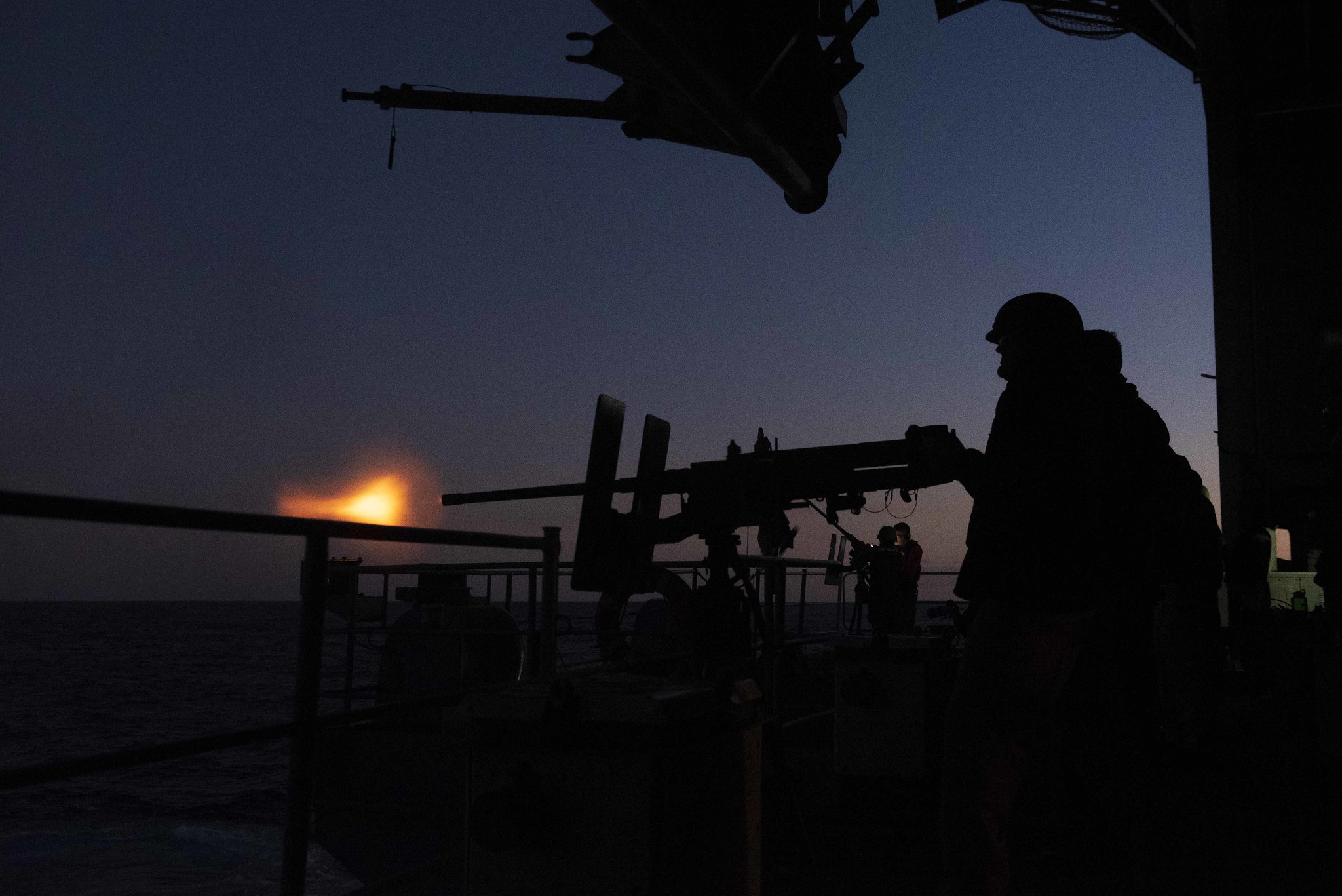 Sailors fire a .50-caliber machine gun Nov. 22, 2019, during a live-fire exercise on the fantail of the Nimitz-class aircraft carrier USS Harry S. Truman (CVN 75) in the Atlantic Ocean. (Mass Communication Specialist Seaman Victoria Sutton/Navy)