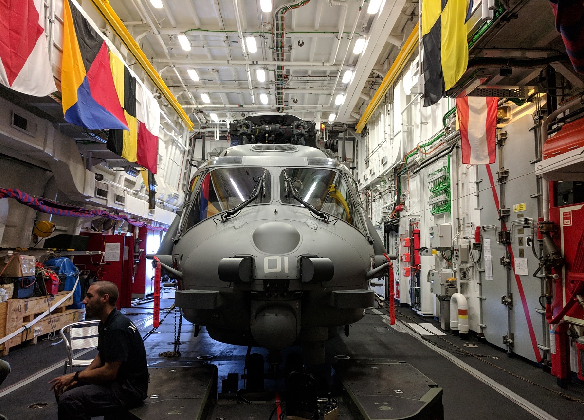 One of the two bays in the Alpino's helicopter hanger has an NH90 folded up inside. (David B. Larter/Staff)