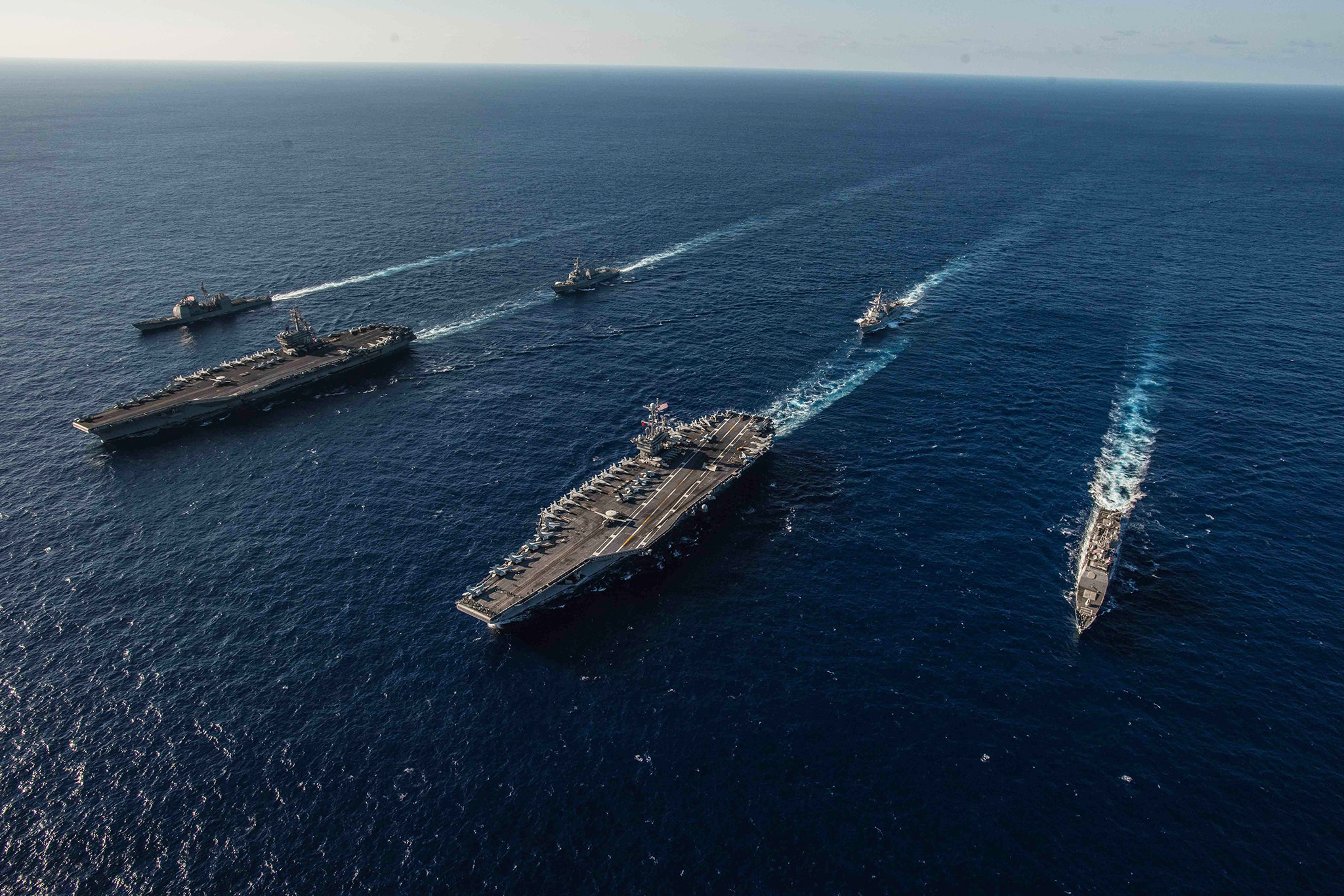 Ships with the Ronald Reagan Carrier Strike Group and John C. Stennis Carrier Strike Group transit the Philippine Sea on Nov. 16, 2018, during dual carrier operations. (MC2 Kaila V. Peters/Navy)