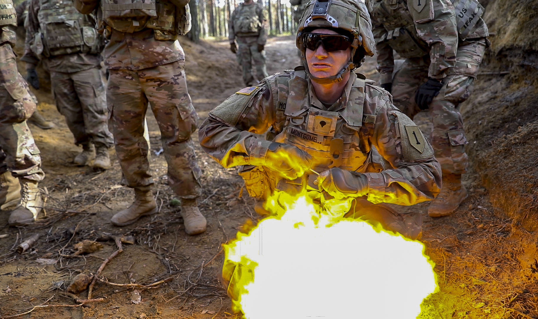 Soldiers from 1st Engineer Battalion, 1st Armored Brigade Combat Team, 1st Infantry Division, take cover March 6, 2019, as a soldier detonates an explosion during live fire explosives training at Joanna range in Zagan, Poland. (Sgt. Thomas Mort/Army)