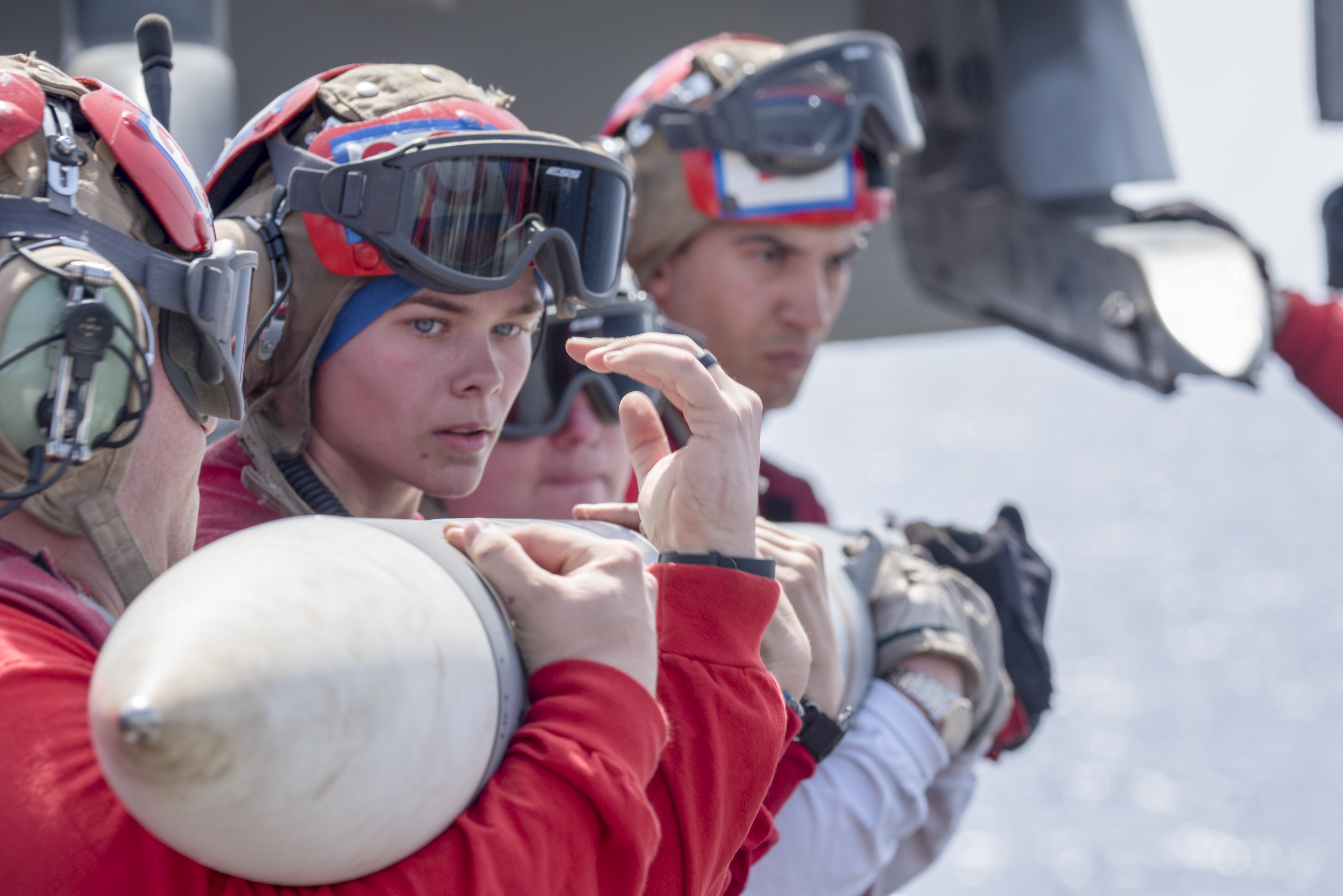 Aviation Ordnanceman Airman Vincina Lonergan works with shipmates to upload ordinance to an F/A-18 Super Hornet on the flight deck aboard the Nimitz-class aircraft USS Harry S. Truman (CVN 75) May 3, 2018. As the Carrier Strike Group 8 flagship, Harry S. Truman's support of Operation Inherent Resolve demonstrates the capability and flexibility of U.S. Naval Forces, and its resolve to eliminate the terrorist group ISIS and the threat it poses. (MC2 Thomas Gooley/Navy)
