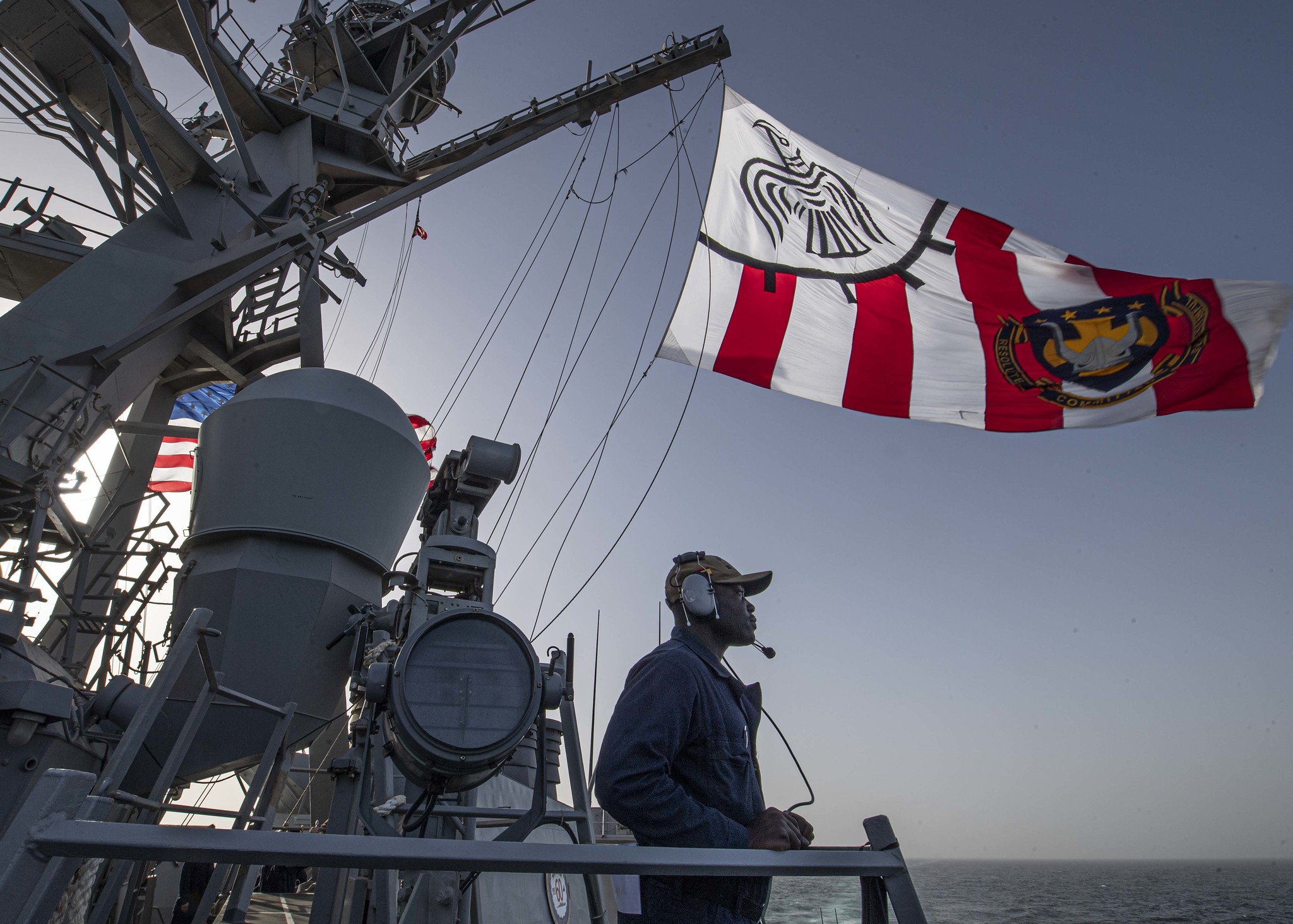 Seaman Divine Owoseni stands watch as the port lookout aboard the guided-missile destroyer Carney (DDG 64) on Feb. 27, 2020, in the Gulf of Oman. (Mass Communication Specialist 1st Class Fred Gray IV/Navy)