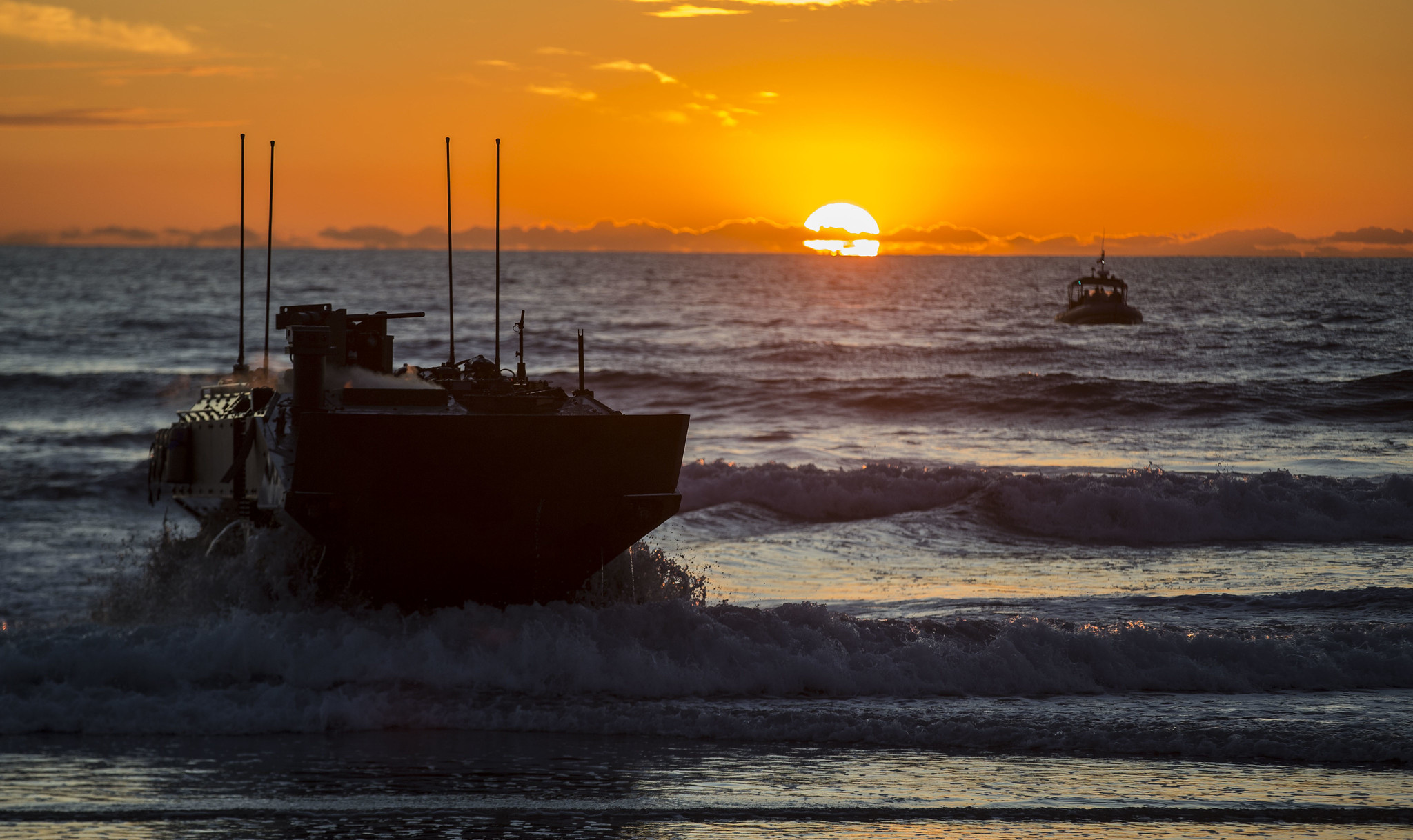 Marines with Amphibious Vehicle Test Branch, Marine Corps Tactical Systems Support Activity, drive a new amphibious combat vehicle ashore Dec. 18, 2019, during low-light surf transit testing at AVTB Beach at Marine Corps Base Camp Pendleton, Calif. (Lance Cpl. Andrew Cortez/Marine Corps)