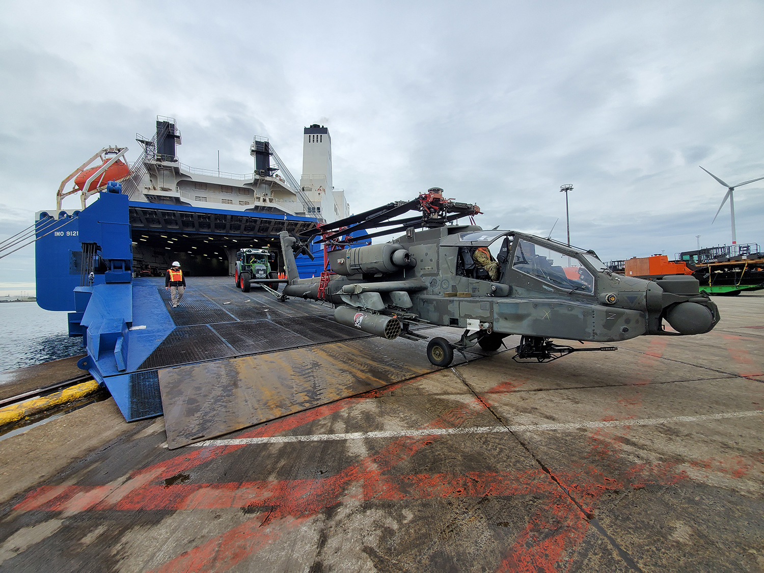 An AH-64 Apache is offloaded from a shipping vessel at the Port of Zeebrugge, Belgium, Oct. 15, 2019. (Sgt. 1st Class Aaron Duncan/Army)
