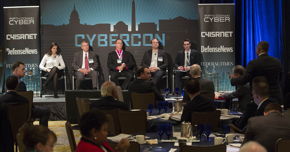 An attendee asks a question of the panel that included Rep. Elise Stefanik (R-NY) Chair House Armed Services Subcommittee on Emerging Threats and Capabilities, David Wallen, Sr. Vice President, Cyber Operations, ManTech International Corp., Dr. George Trawick, Ph.D., Assistant Professor, College of Information and Cyberspace, National Defense University discuss Information Warfare: The Cyber Component during a Panel moderated by Mark Pomerlau, right, reporter for C4ISRNET during Cybercon 2017 at the Ritz-Carlton Hotel in Pentagon City on Nov. 28, 2017. ( Ben Murray/Staff)