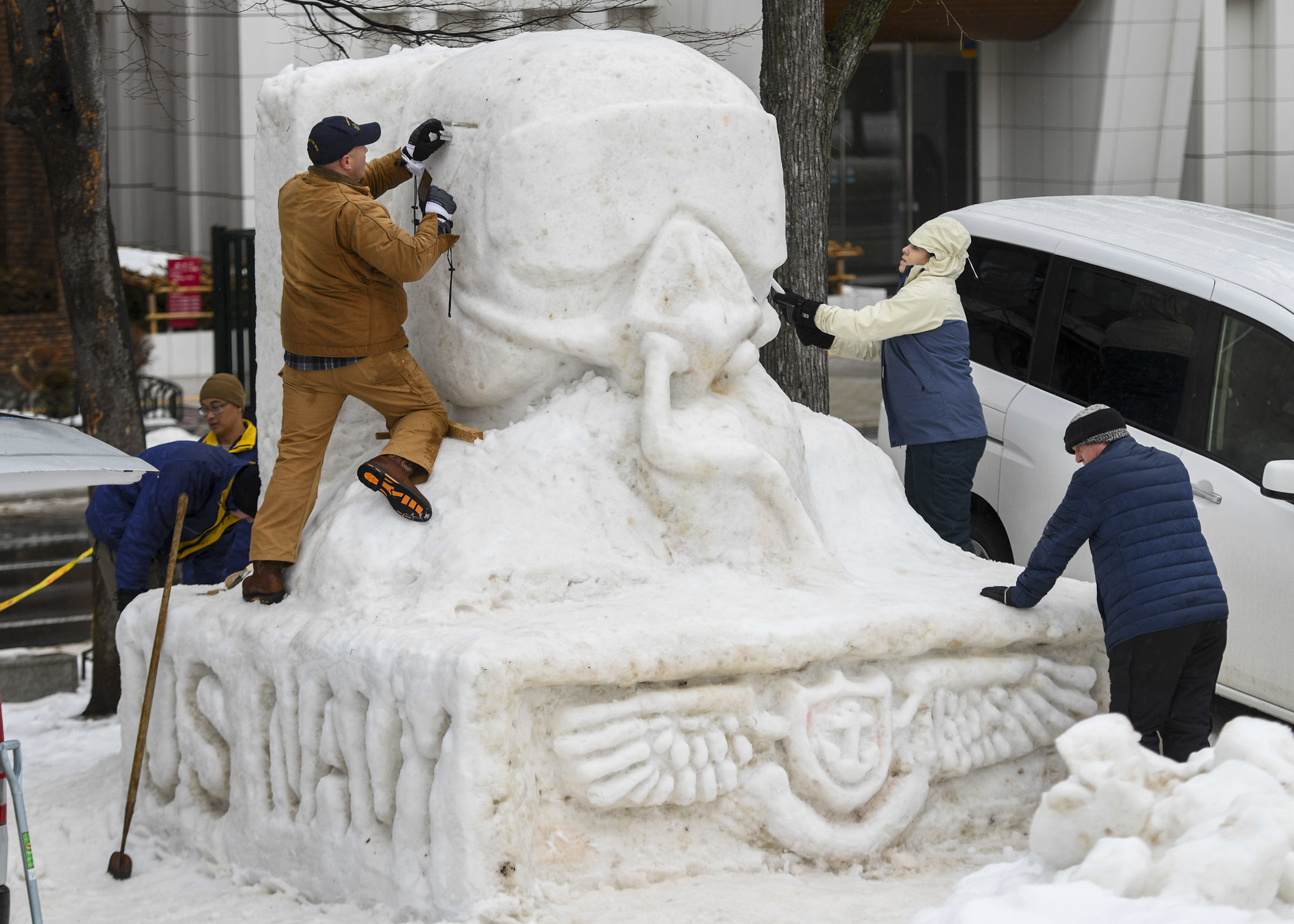 Sailors from Naval Air Facility Misawa, Japan, and tenant commands sculpt a snow statue Jan. 30, 2020, during the 71st annual Sapporo Snow Festival. (Mass Communication Specialist 3rd Class Jan David De Luna Mercado/Navy)