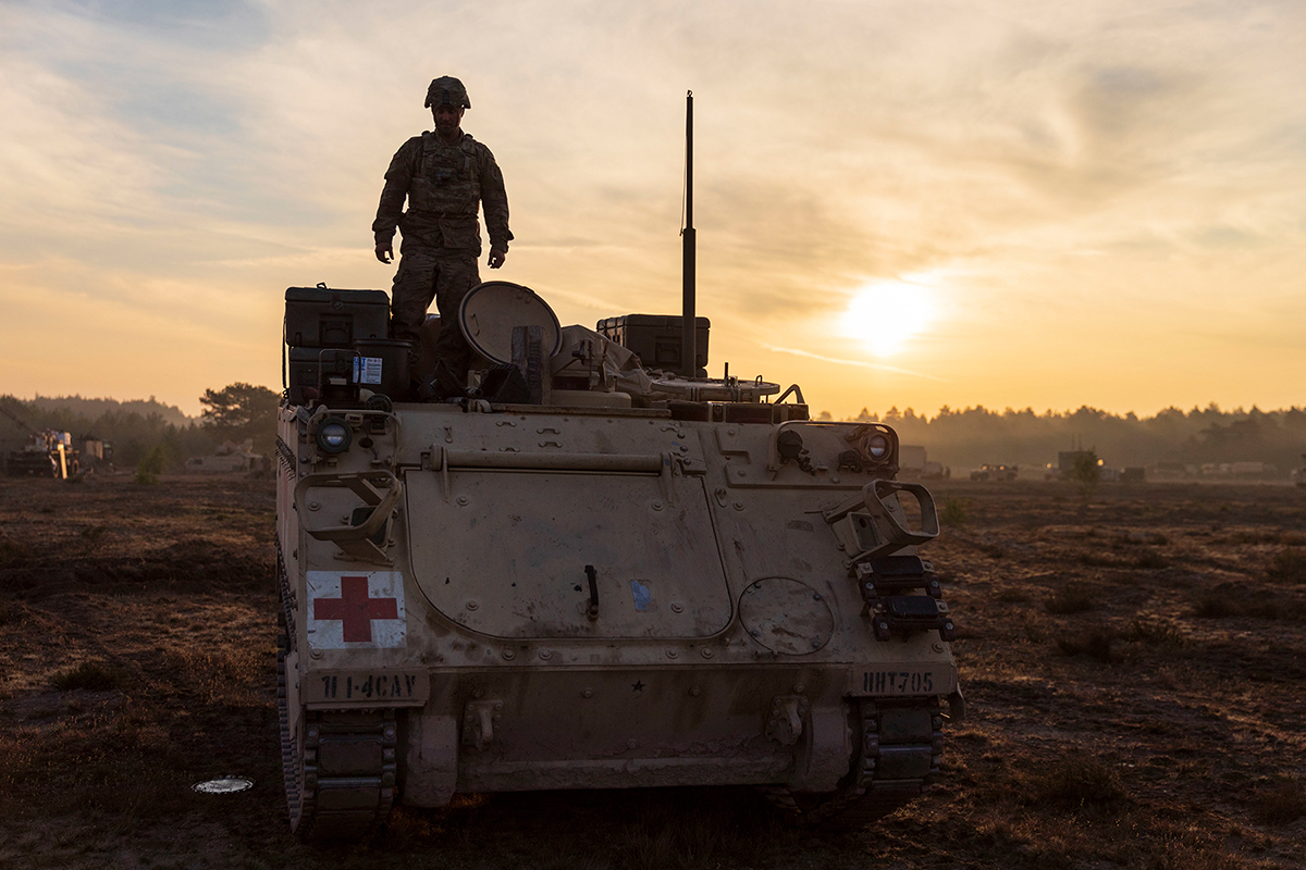 A soldier prepares an M113 armored personnel carrier for a convoy during a rapid-deployment exercise at Johanna Range, Poland, May 20, 2019. (Sgt. Thomas Mort/Army)