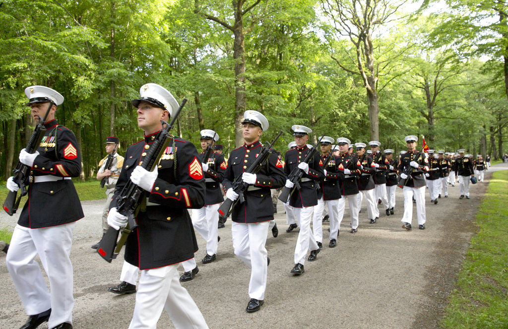 U.S. Marines march through the battlefield of Belleau Wood prior to a Memorial Day commemoration at the Aisne-Marne American Cemetery in Belleau, France, Sunday, May 27, 2018. The cemetery contains more that 2,000 American dead. (Virginia Mayo/AP)