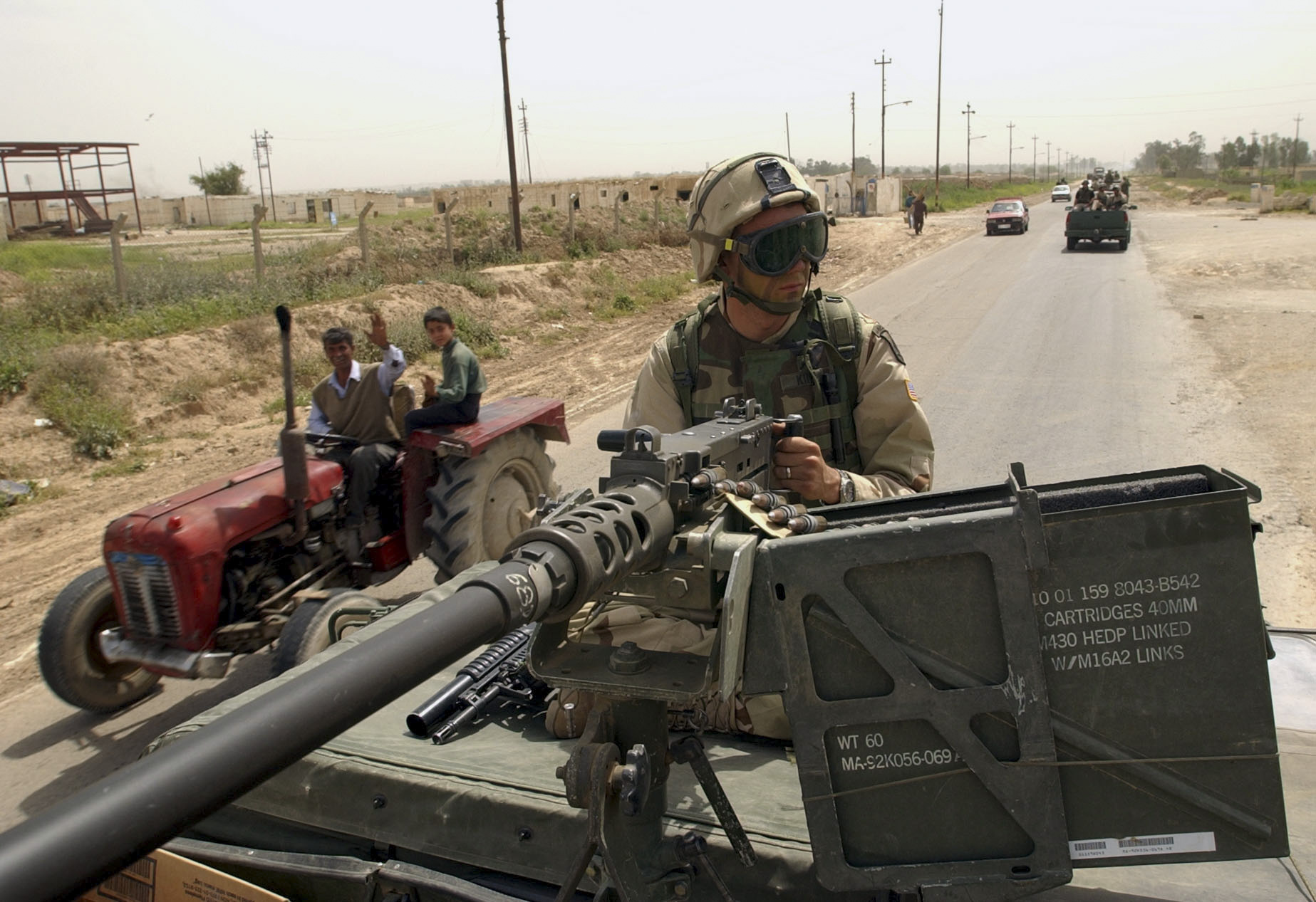 U.S. Army Pvt. Troy King, from Denver, Colorado, mans a .50 cal machine gun on his humve while escorting members of a U.S. Air Force Global Airfield Assesment Team (GAAT) from McGuire AFB in New Jersey. King is from the 173rd, 1st of the 508, who gave the GAAT added security as they convoyed from Karkuk Air Base to K-1, another Iraqi military airfield on the outskirts of Karkuk. Once there, the GAAT team measured and tested the quality of the runways and parking ramps to see if they could support the weight of heavy aircraft. (Alan Lessig/Air Force Times)