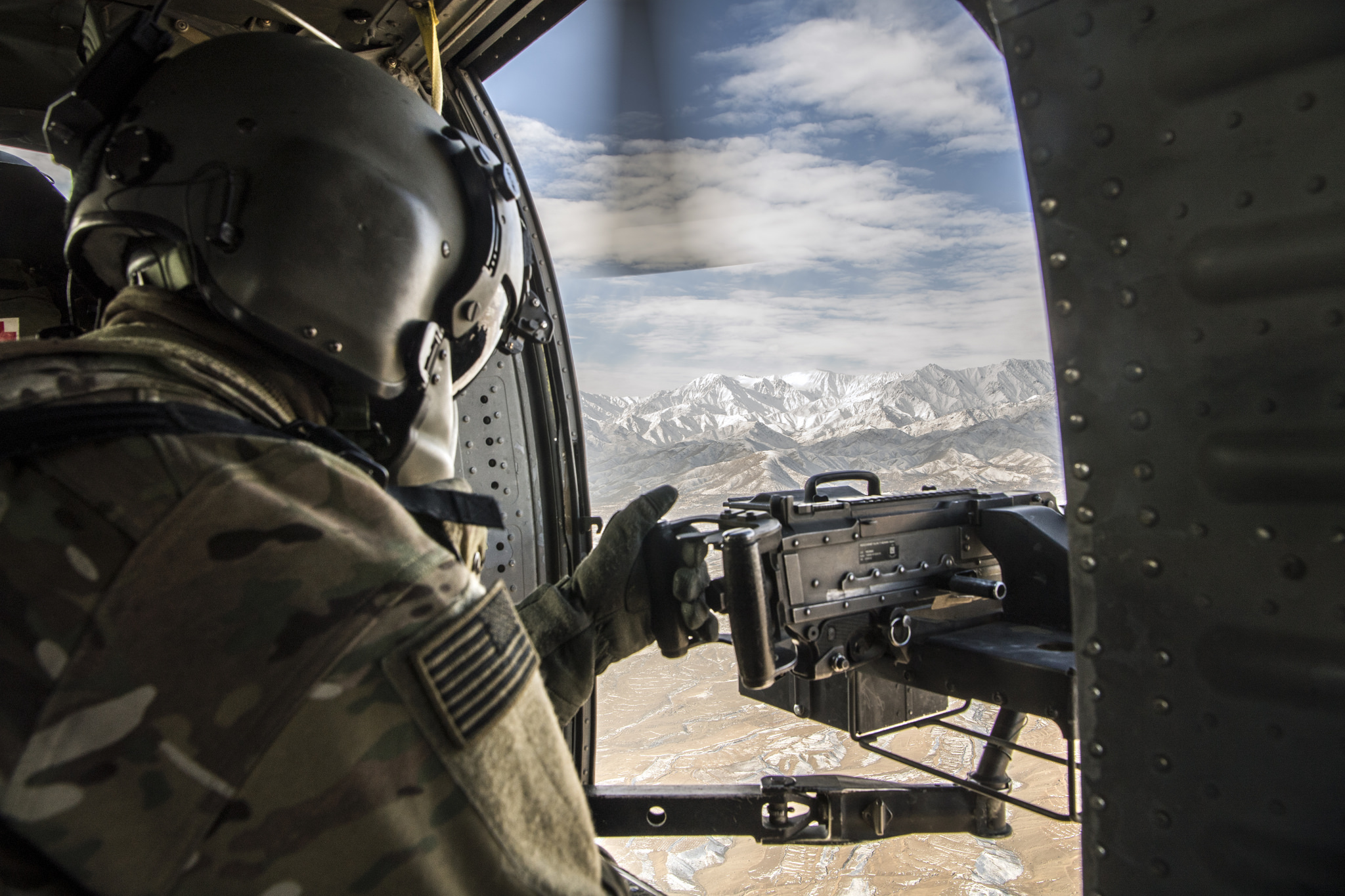 U.S. Army Soldier, assigned to 3rd Infantry Division, conducts aerial observation over Afghanistan. U.S. Army photo by John Martinez